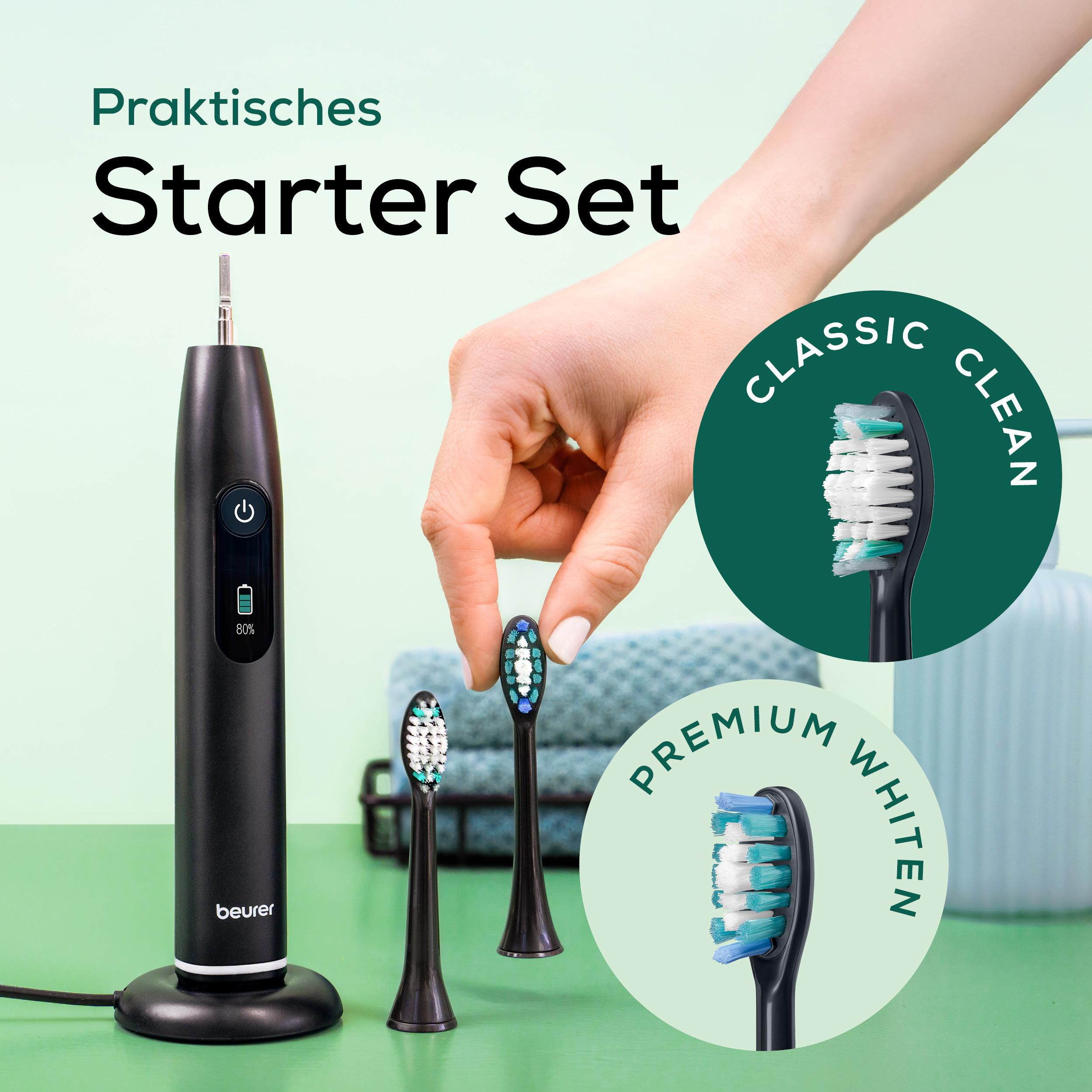 Ein schwarzes E-Zahnbürsten-Set mit drei Aufsätzen und Ladebasis.