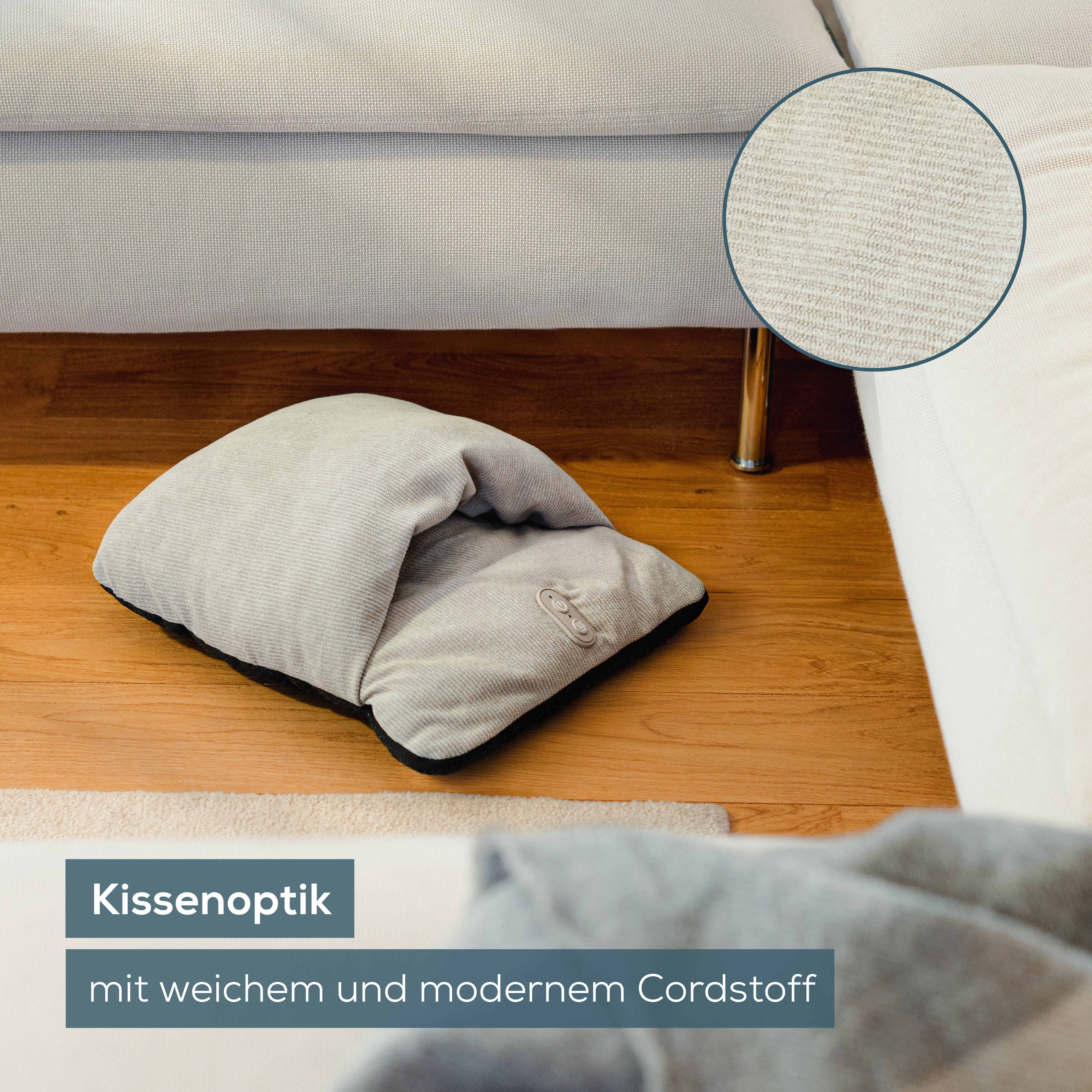 Ein weiches Kissen mit Bedienelementen liegt auf einem Holzboden.