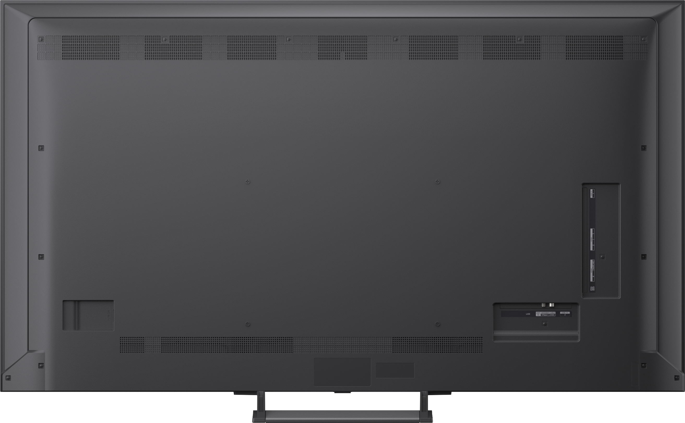 Rückseite eines dunklen Fernsehers mit Anschlüssen und Lüftungsschlitzen.