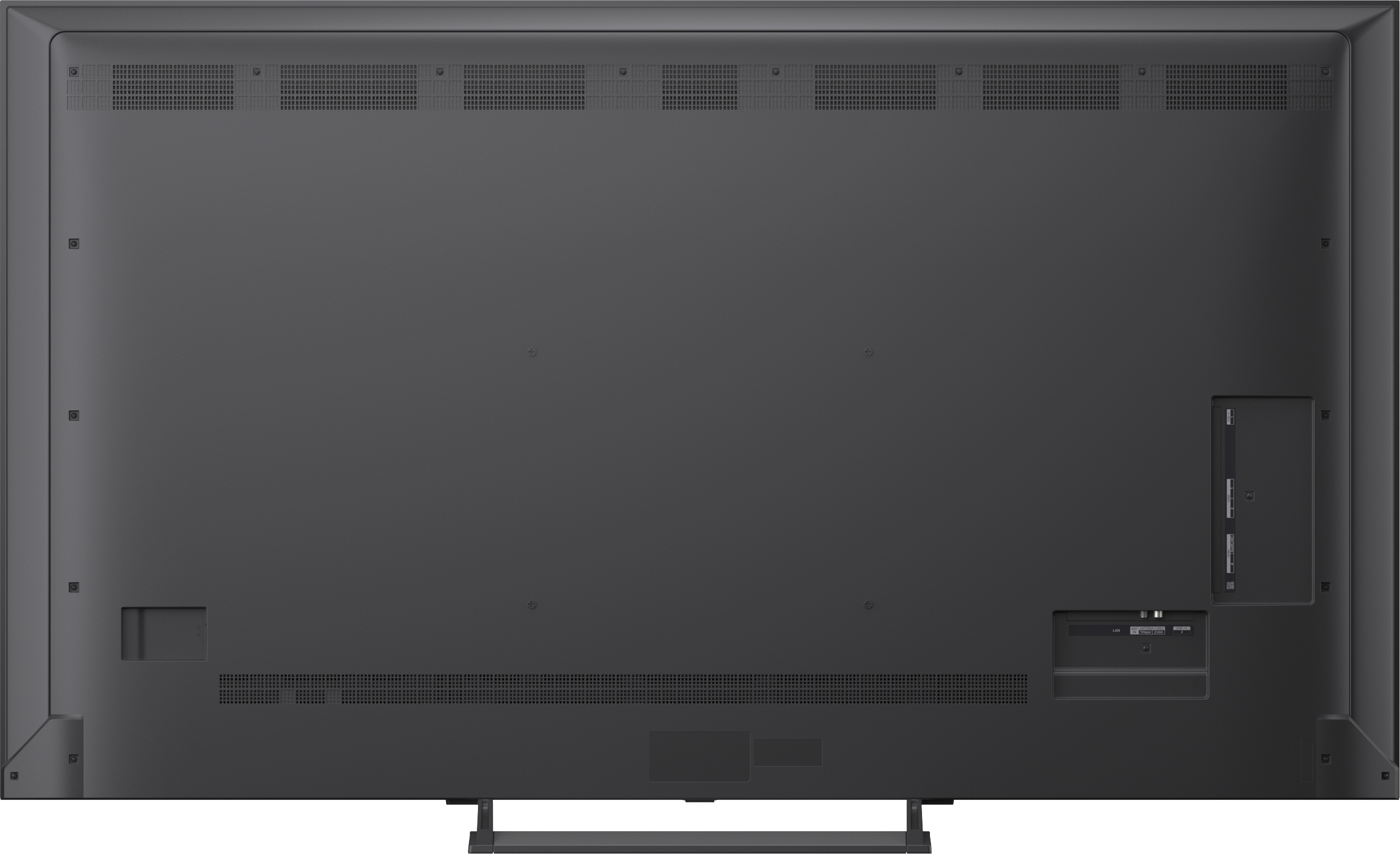 Die Rückseite eines großen, dunklen Fernsehers mit Anschlüssen und Lüftungsschlitzen.