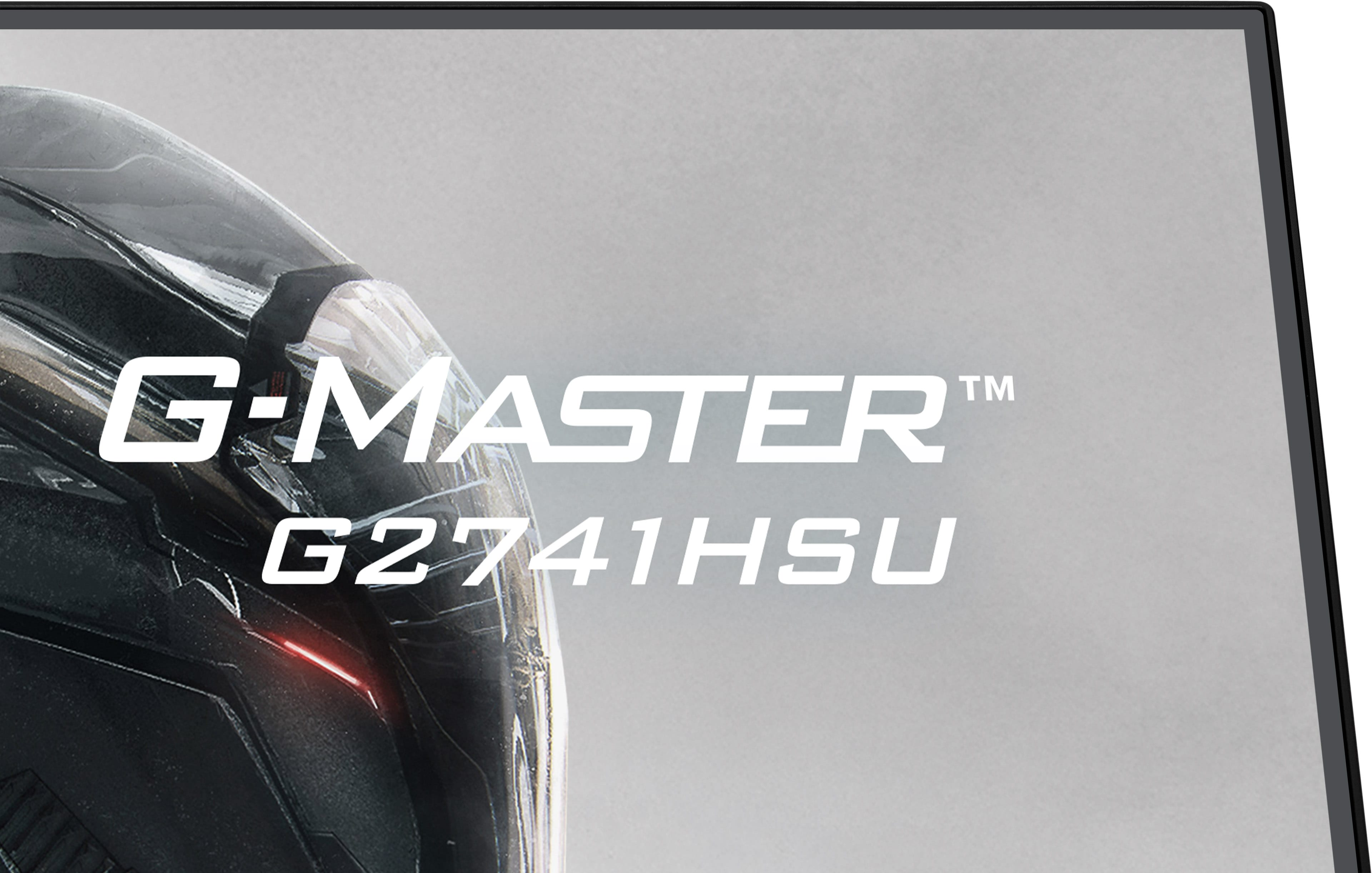 Ciemny, stylizowany hełm z czerwonym akcentem świetlnym. Napis: G-MASTER G2741HSU.