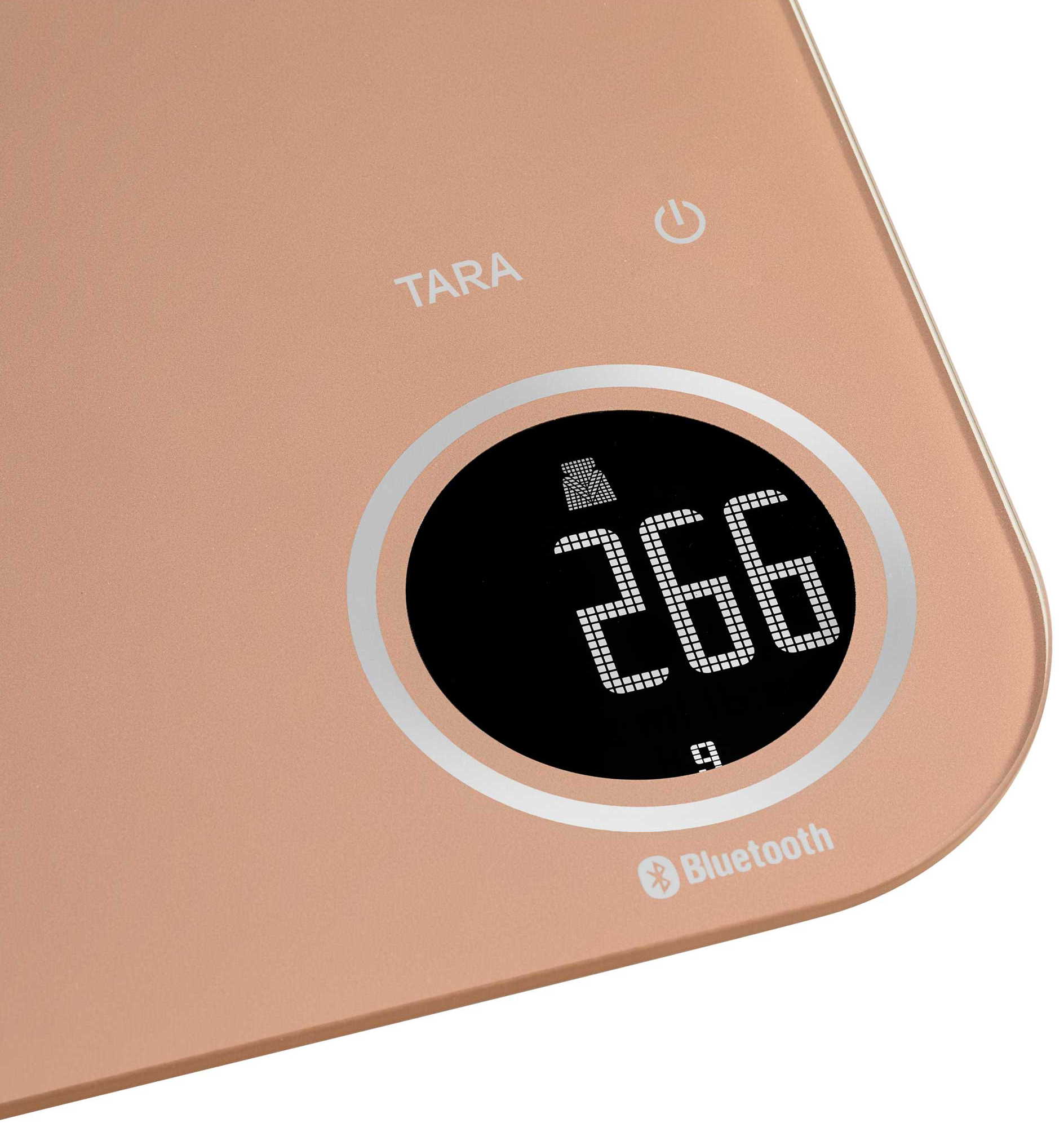 Egy rózsaarany színű digitális mérleg 266g kijelzéssel és Bluetooth szimbólummal.