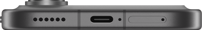Okostelefon alsó élének közelképe, USB-C porttal és hangszórórácsokkal.