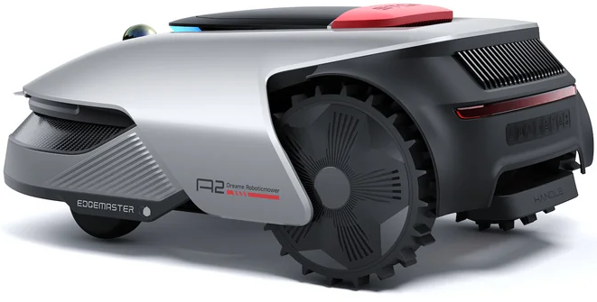 Silberner Mähroboter mit großen schwarzen Rädern und roter Oberseite.