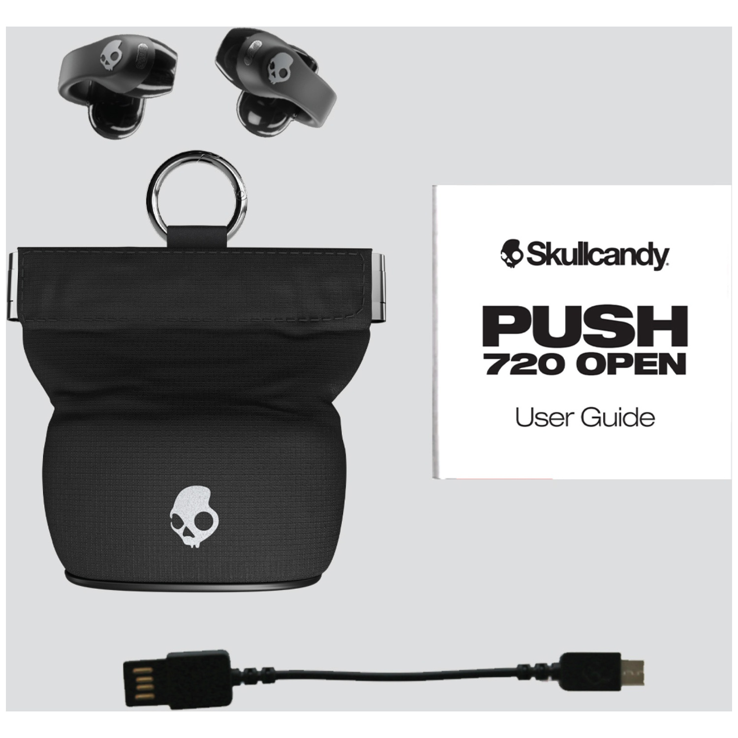 Écouteurs Skullcandy noirs avec étui de chargement, câble USB et manuel.