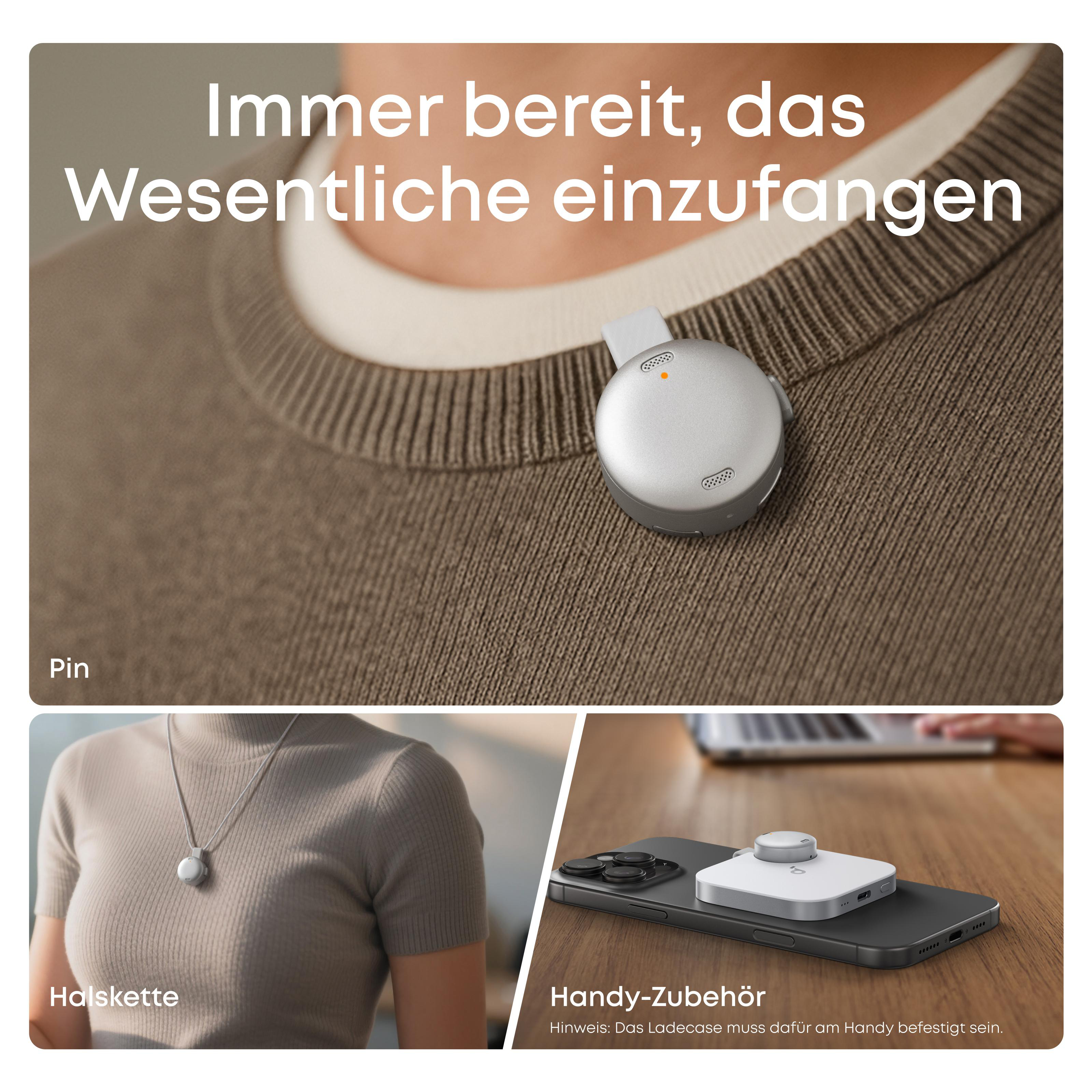 Silbernes Pin am Pullover, Kette, Handy-Zubehör auf Handy.