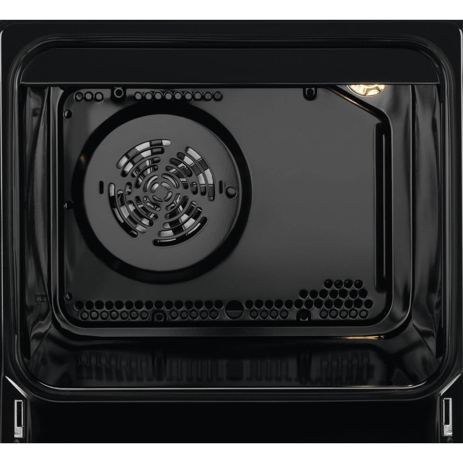 Interno di un forno nero con ventola e luce.