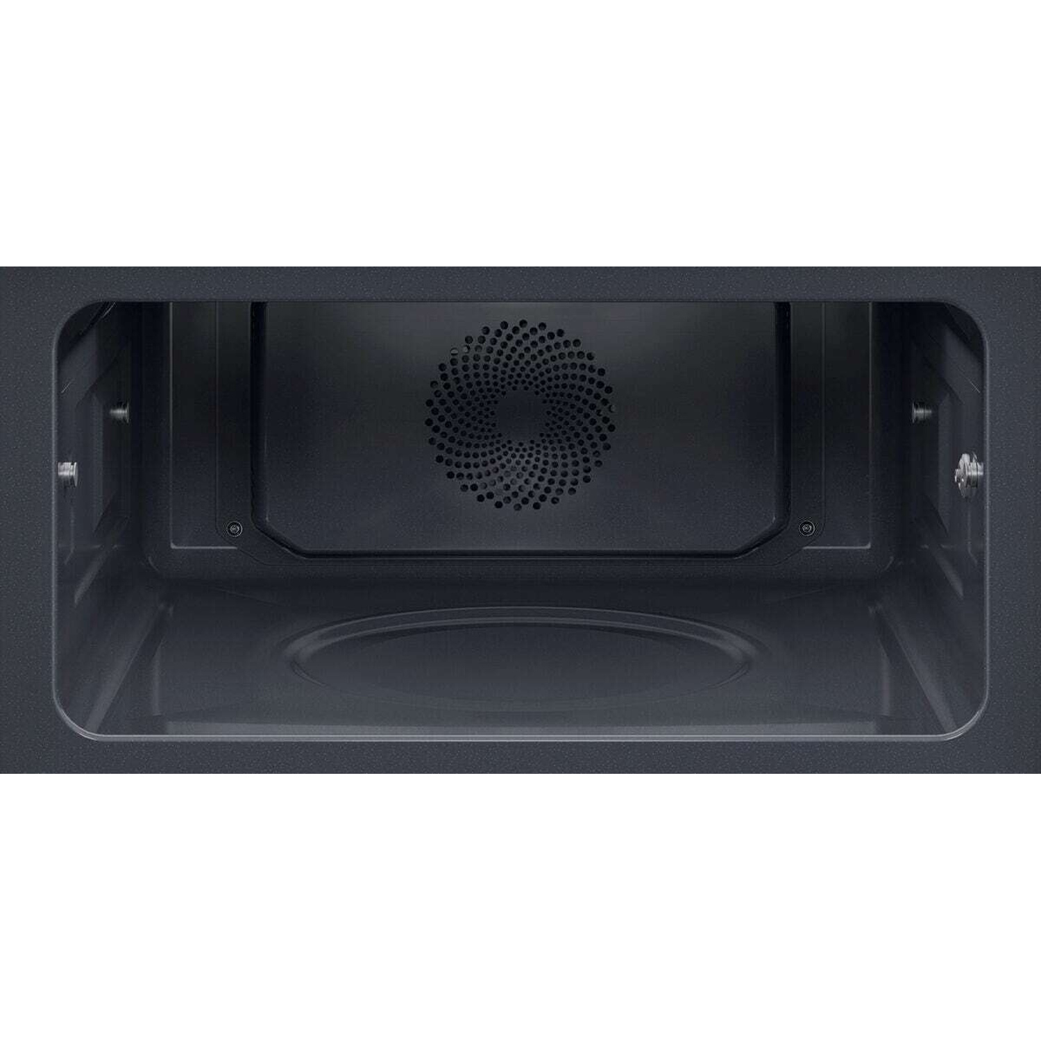 Interno di un forno a microonde che mostra la griglia del ventilatore e la base del piatto girevole.