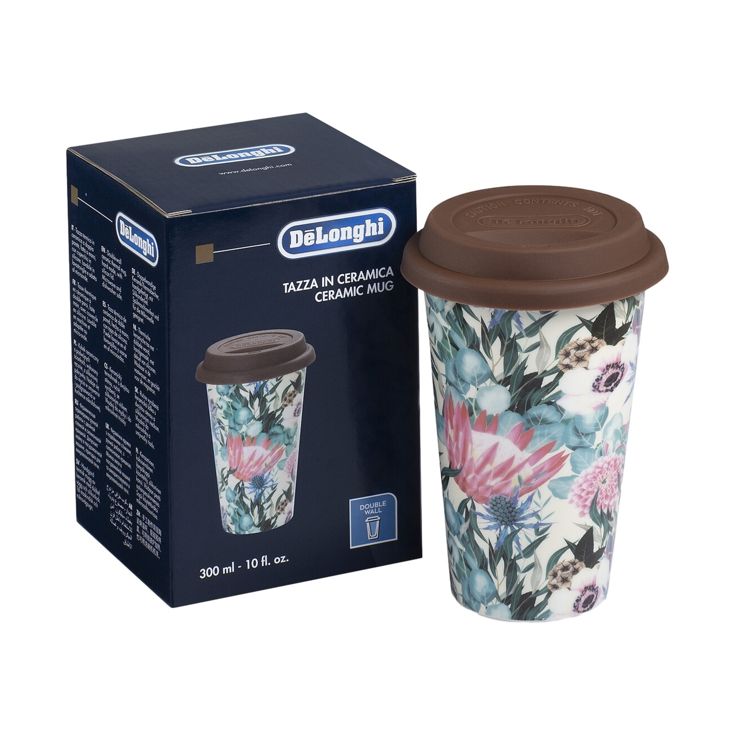 Una tazza in ceramica color crema con stampa floreale e coperchio marrone accanto alla sua confezione.