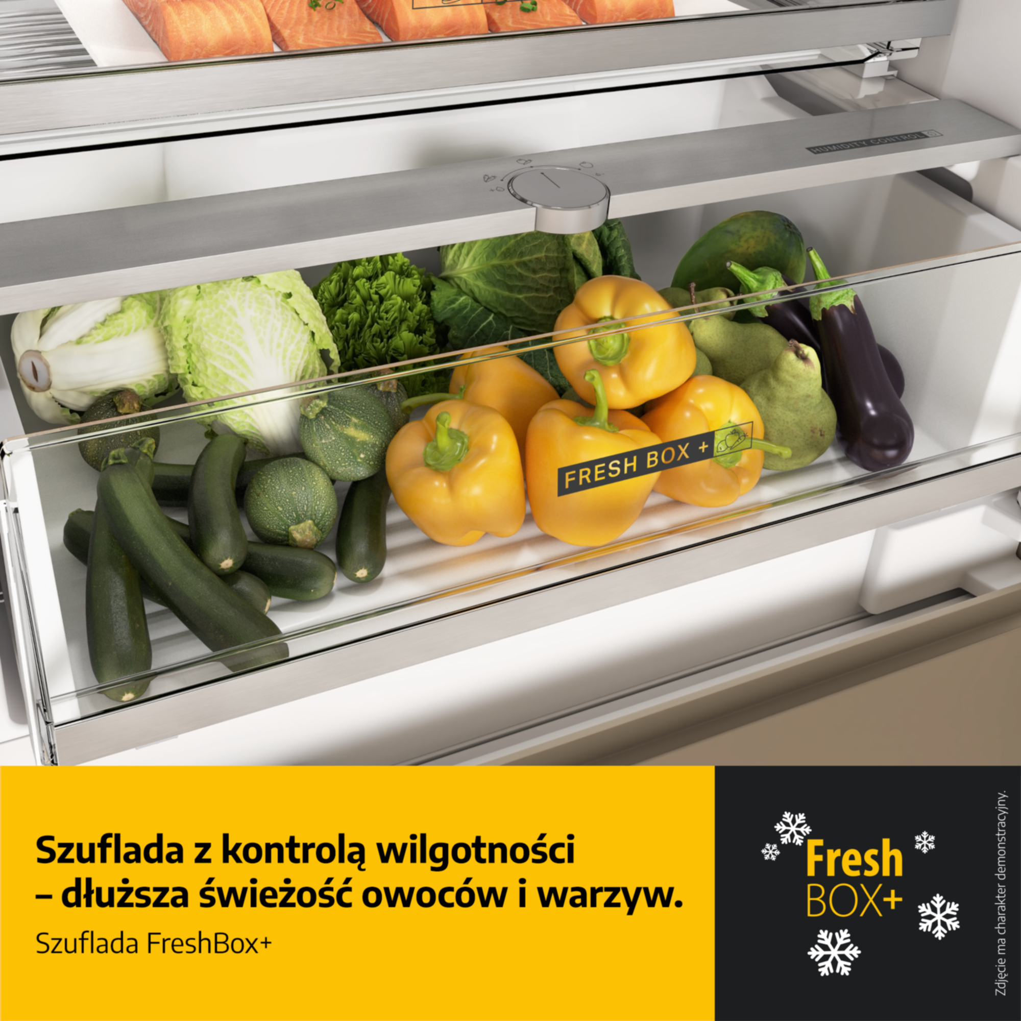 Szuflada lodówki z warzywami: papryka, cukinia, bakłażan, kapusta.