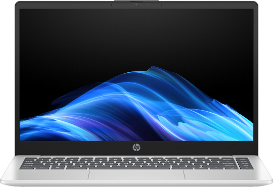 Egy ezüst laptop sötét képernyőjén kék és lila hullámos háttérkép látható.