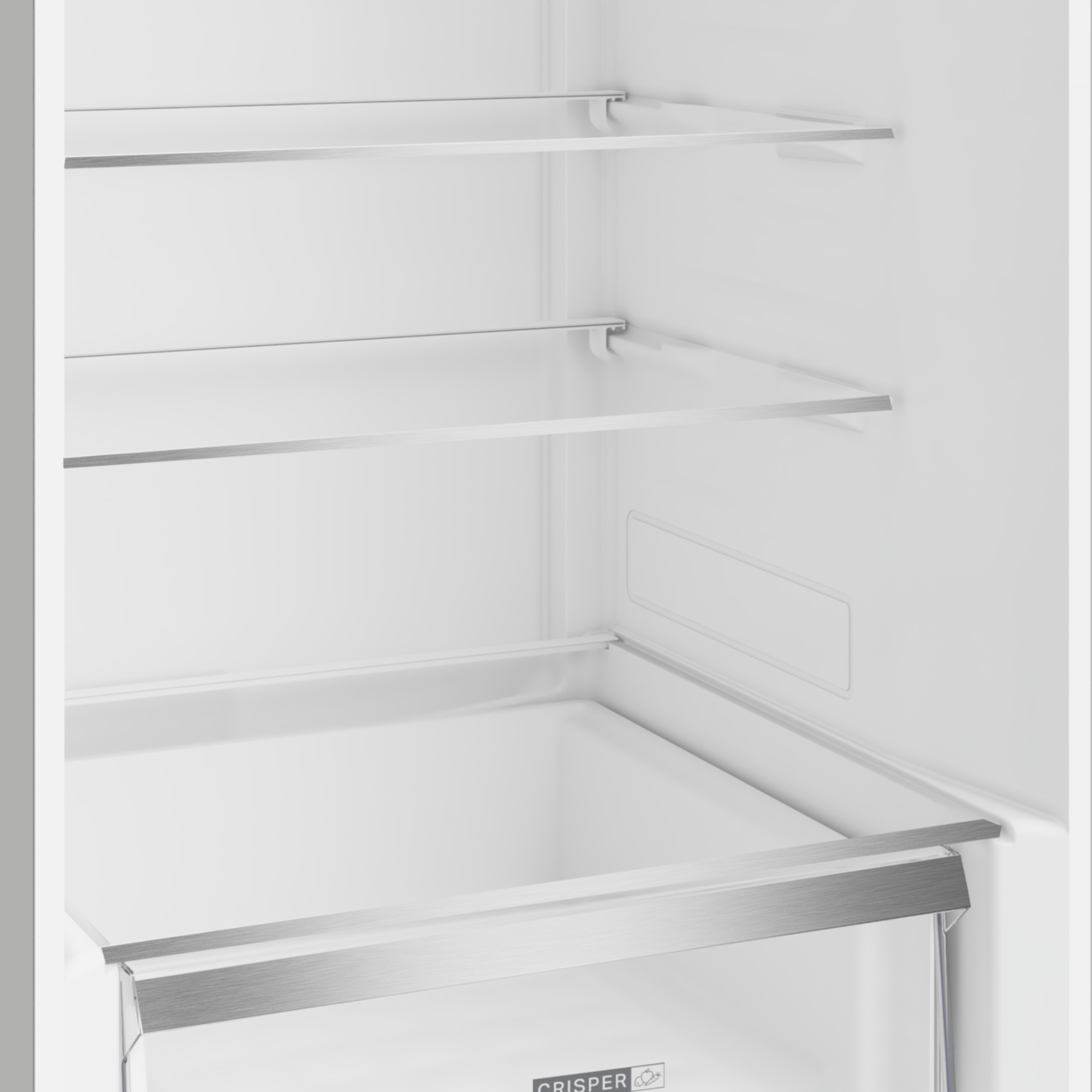 Widok wnętrza pustej lodówki ze szklanymi półkami i szufladą.