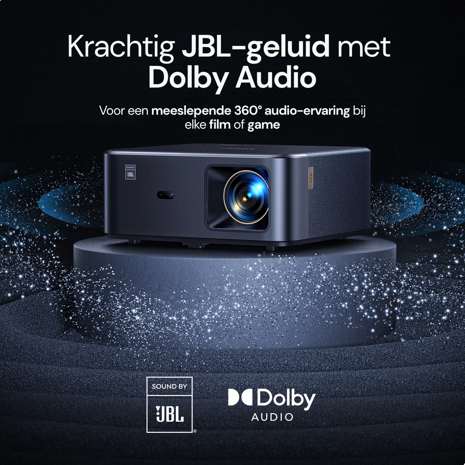 A dark projector on a pedestal, with JBL and Dolby Audio logos.