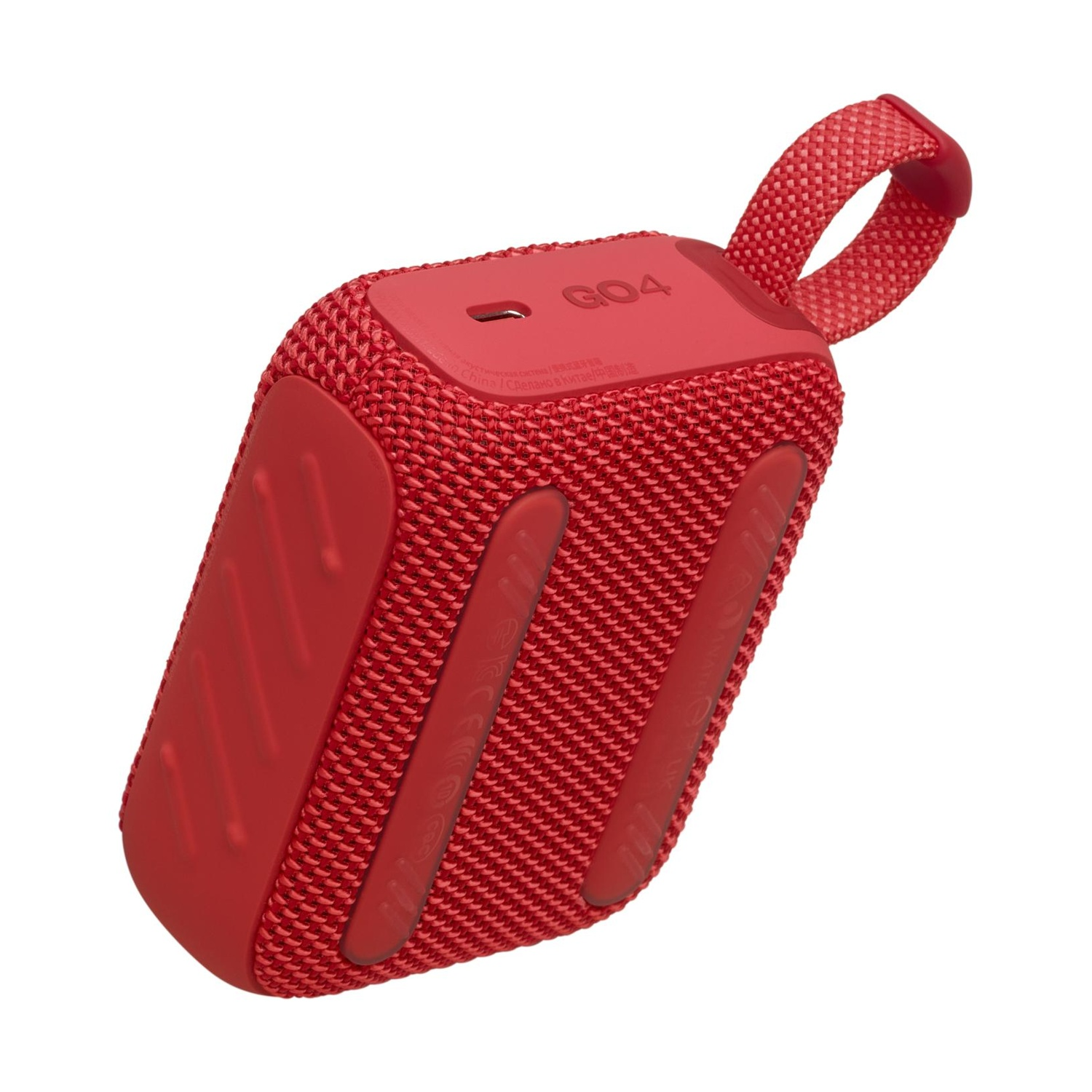 Un altoparlante portatile rosso con copertura in tessuto e anello superiore.