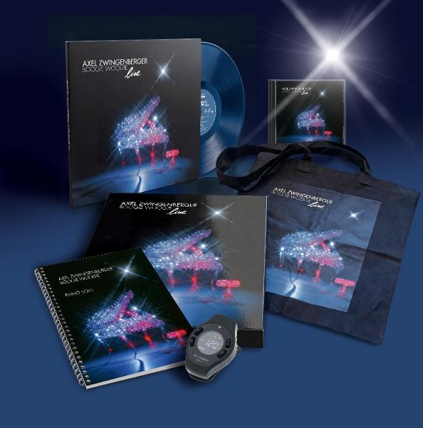 Eine Sammlung von Axel Zwingenberger Live-Produkten, darunter Vinyl, CD, Notenbuch und Tasche.