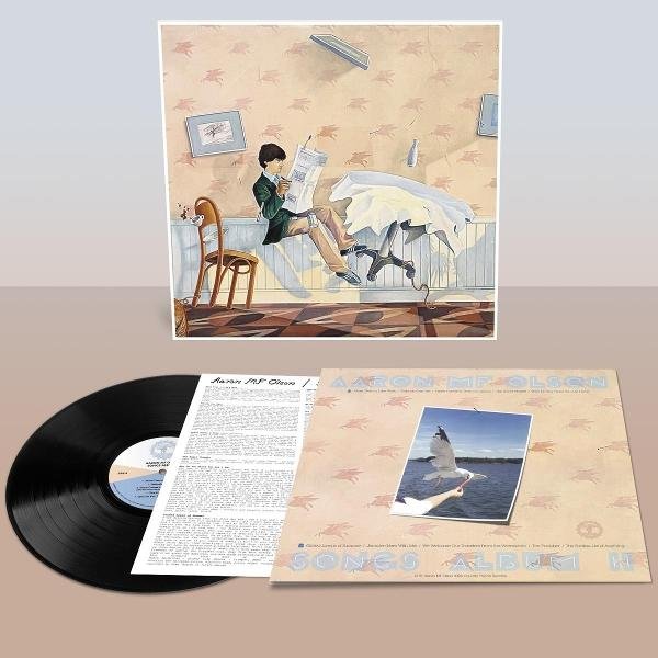 Eine Schallplatte und ein Albumcover mit einem Gemälde eines jungen Mannes beim Lesen und einem Möwenbild.
