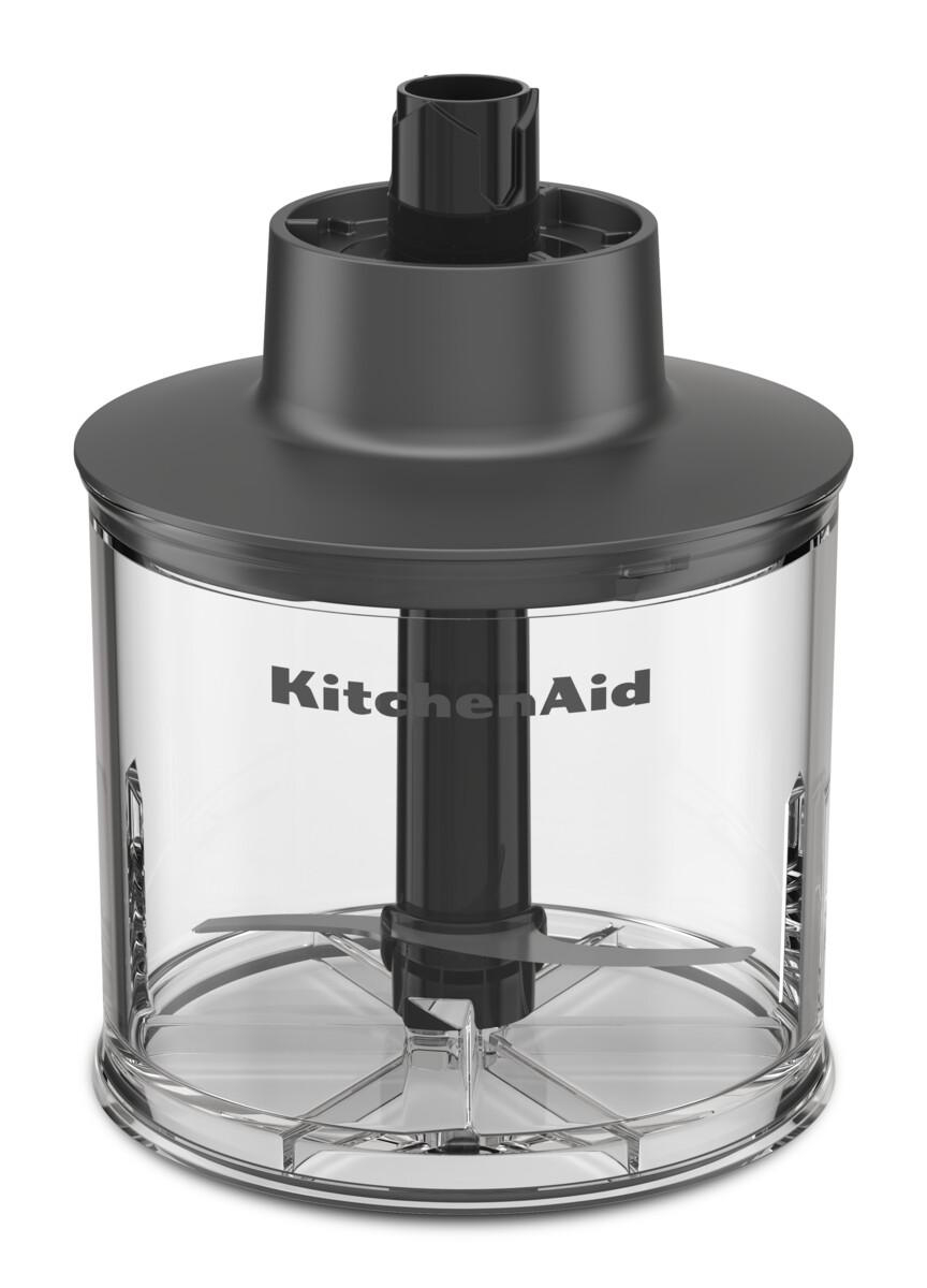 Ein transparenter Zerkleinerer mit Klingen und KitchenAid-Logo.