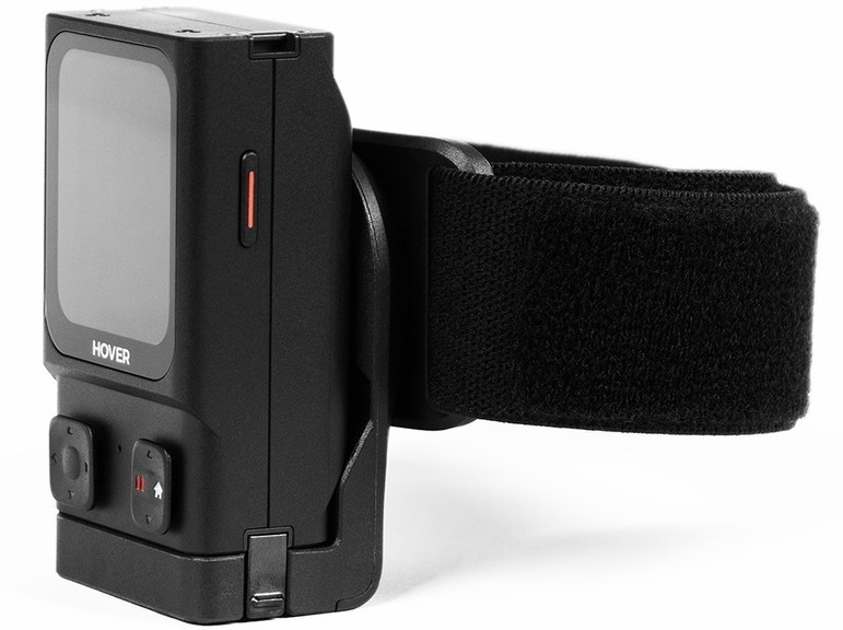 Schwarzes Kamerasystem mit Armband, auf weißem Hintergrund.