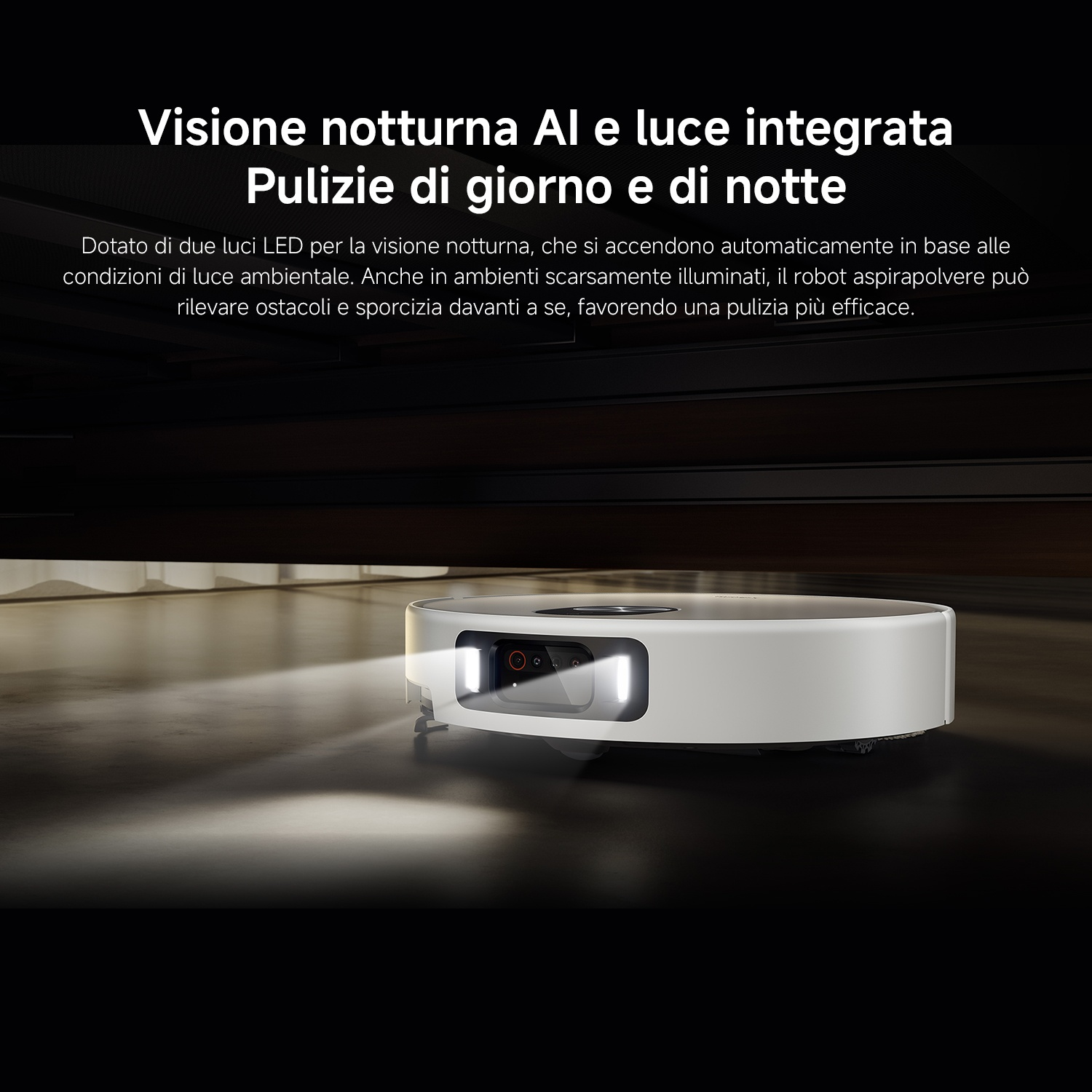 Un robot aspirapolvere bianco con fari LED attivi su un pavimento scuro.