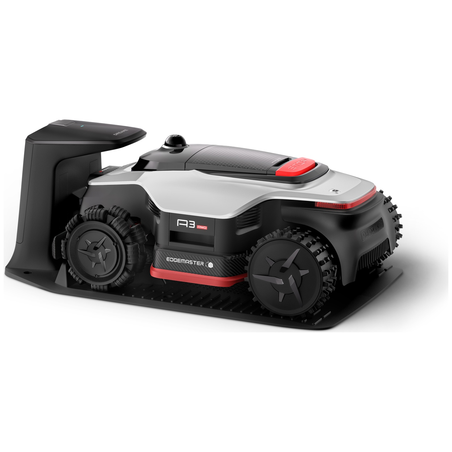 A silver robotic lawnmower with black wheels and red accents sits on a black mat.