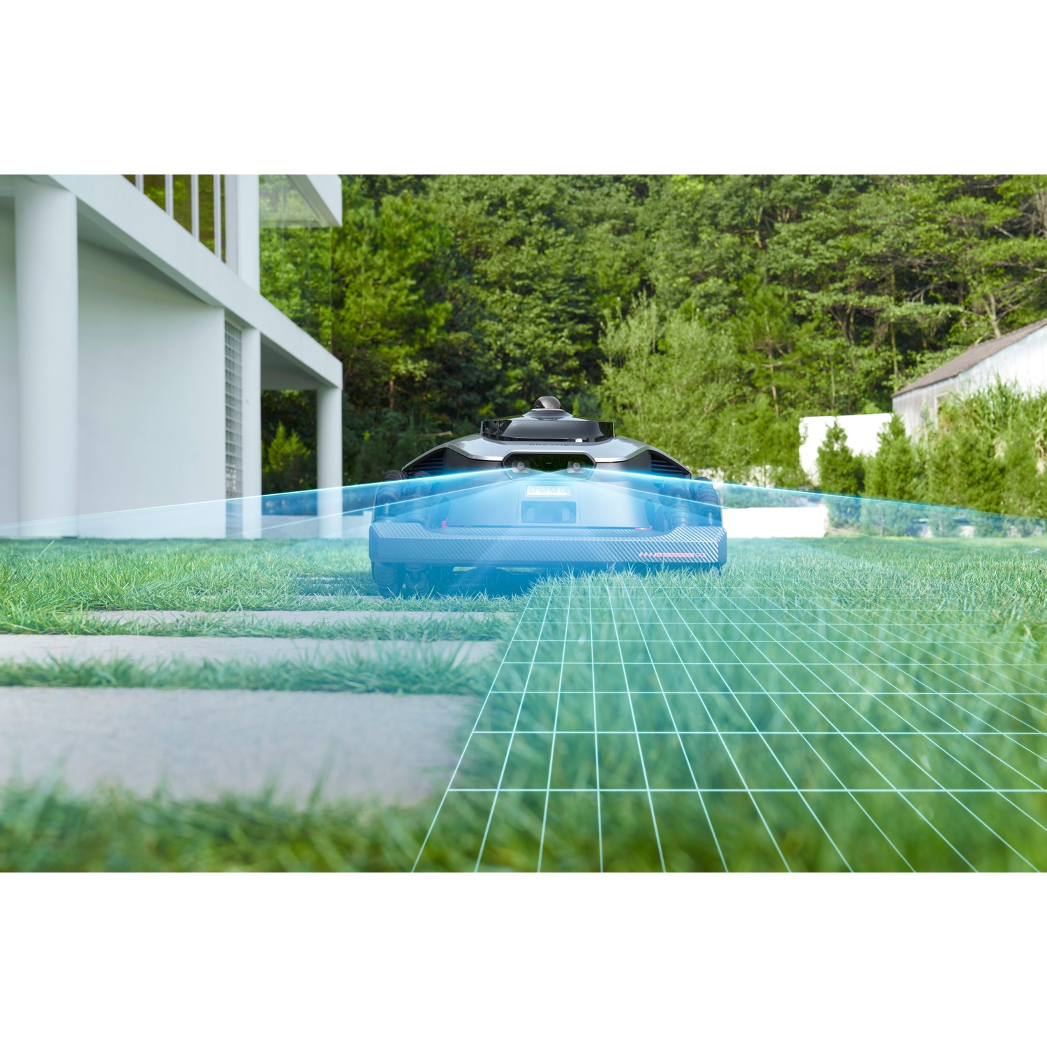 A robotic mower on a lawn with a modern house in the background.