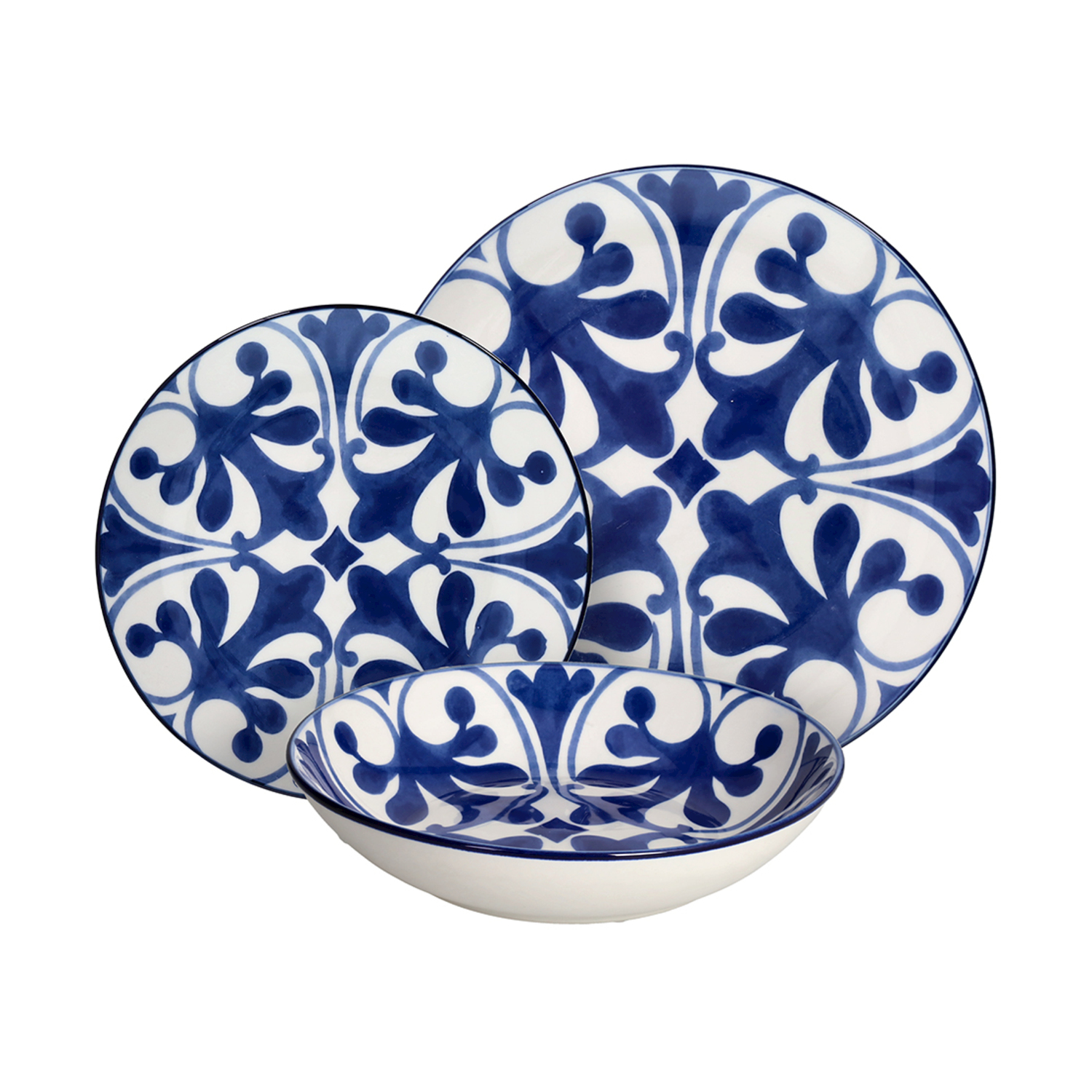 Un set di stoviglie bianche con motivo floreale blu, include piatti e una ciotola.