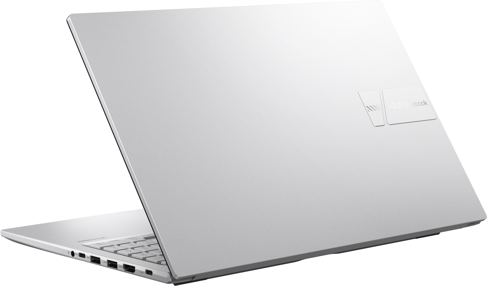 Un ordinateur portable Asus Vivobook argenté est ouvert, montrant le clavier et les ports.