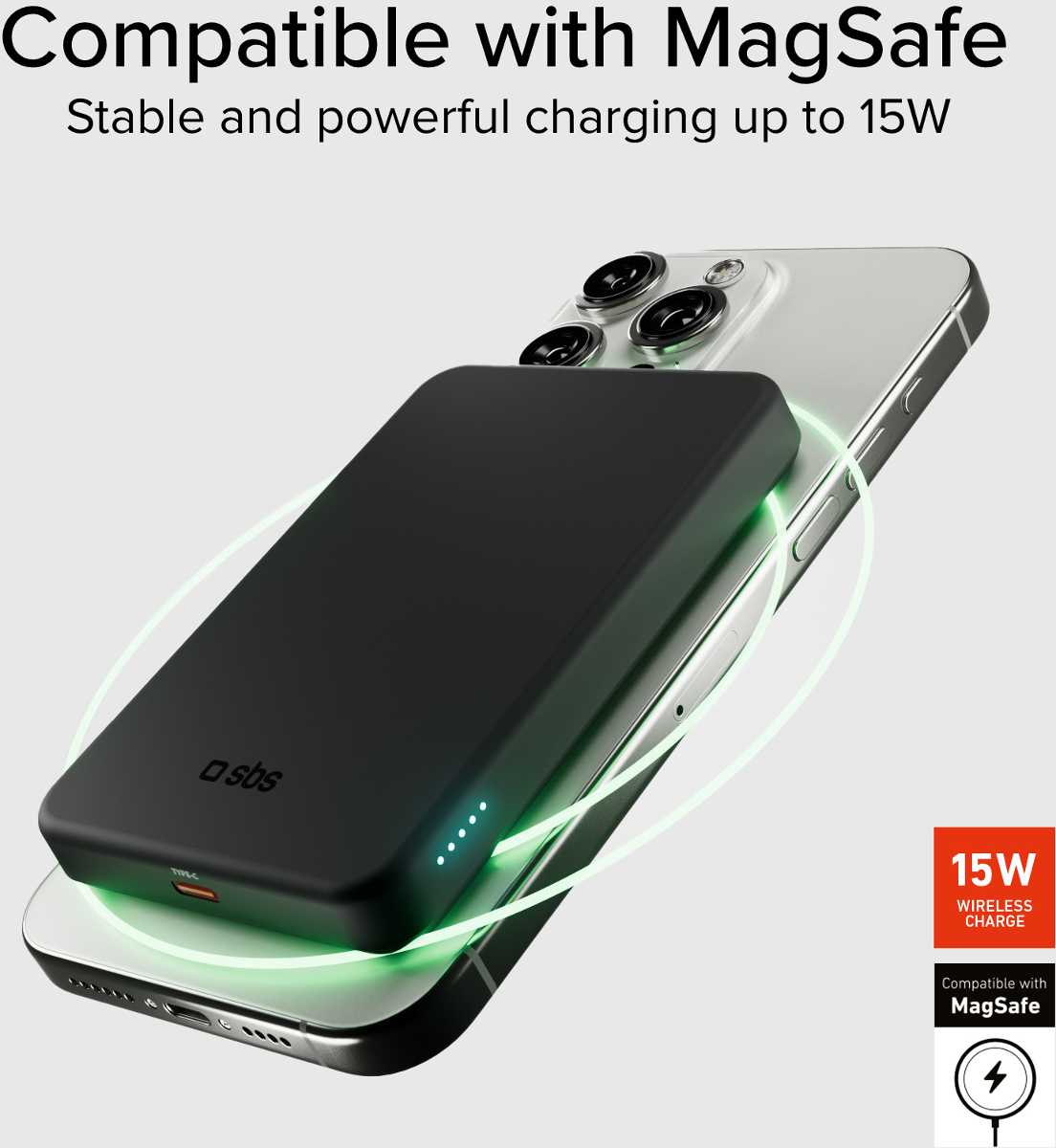 Schwarzes Mag-Safe Ladegerät auf silbernem iPhone, leuchtet grün.