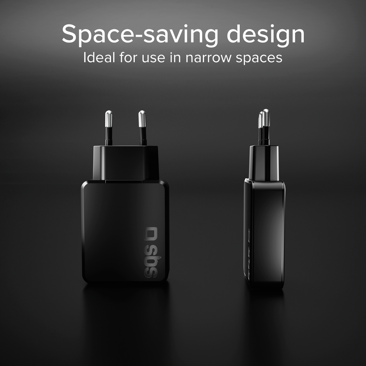 Zwei kompakte schwarze Netzadapter mit silbernen Stiften auf dunklem Grund.