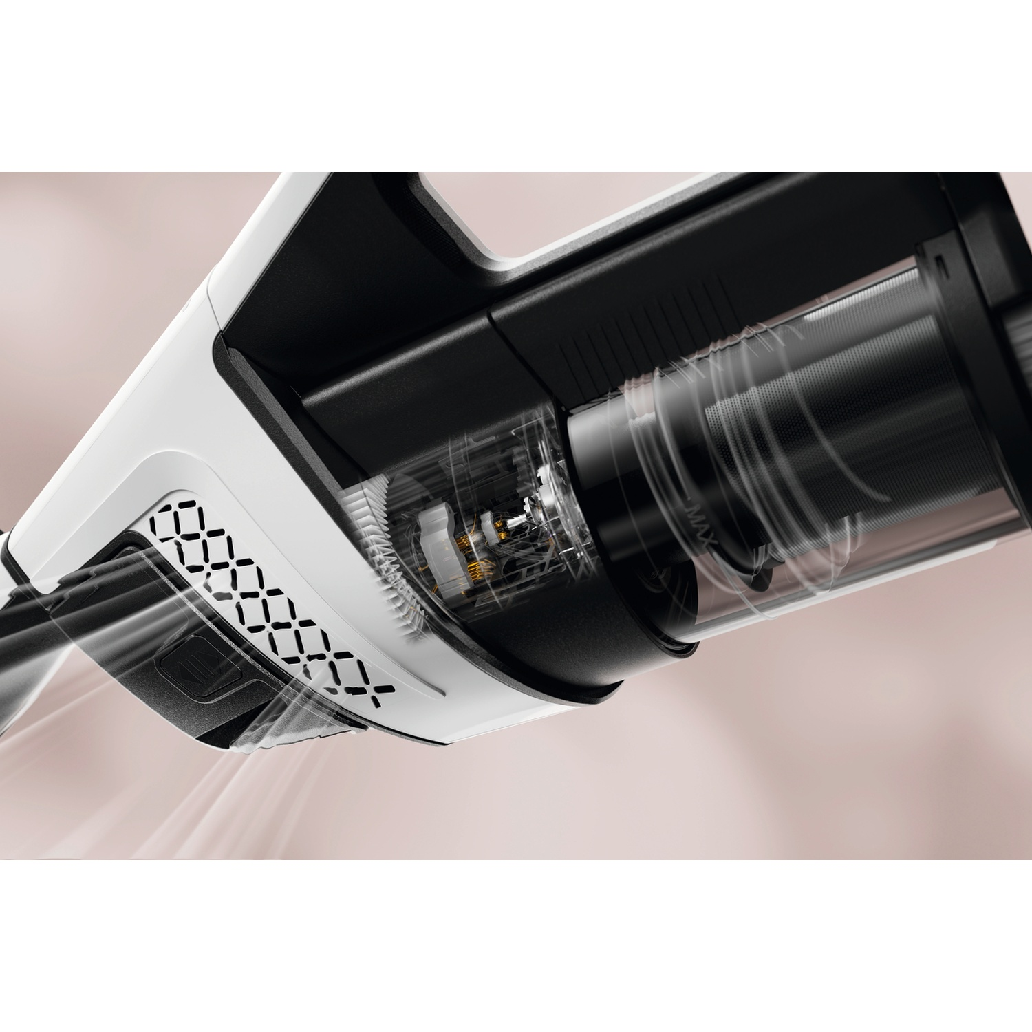 Gros plan du réservoir transparent et du moteur d'un aspirateur blanc et noir.
