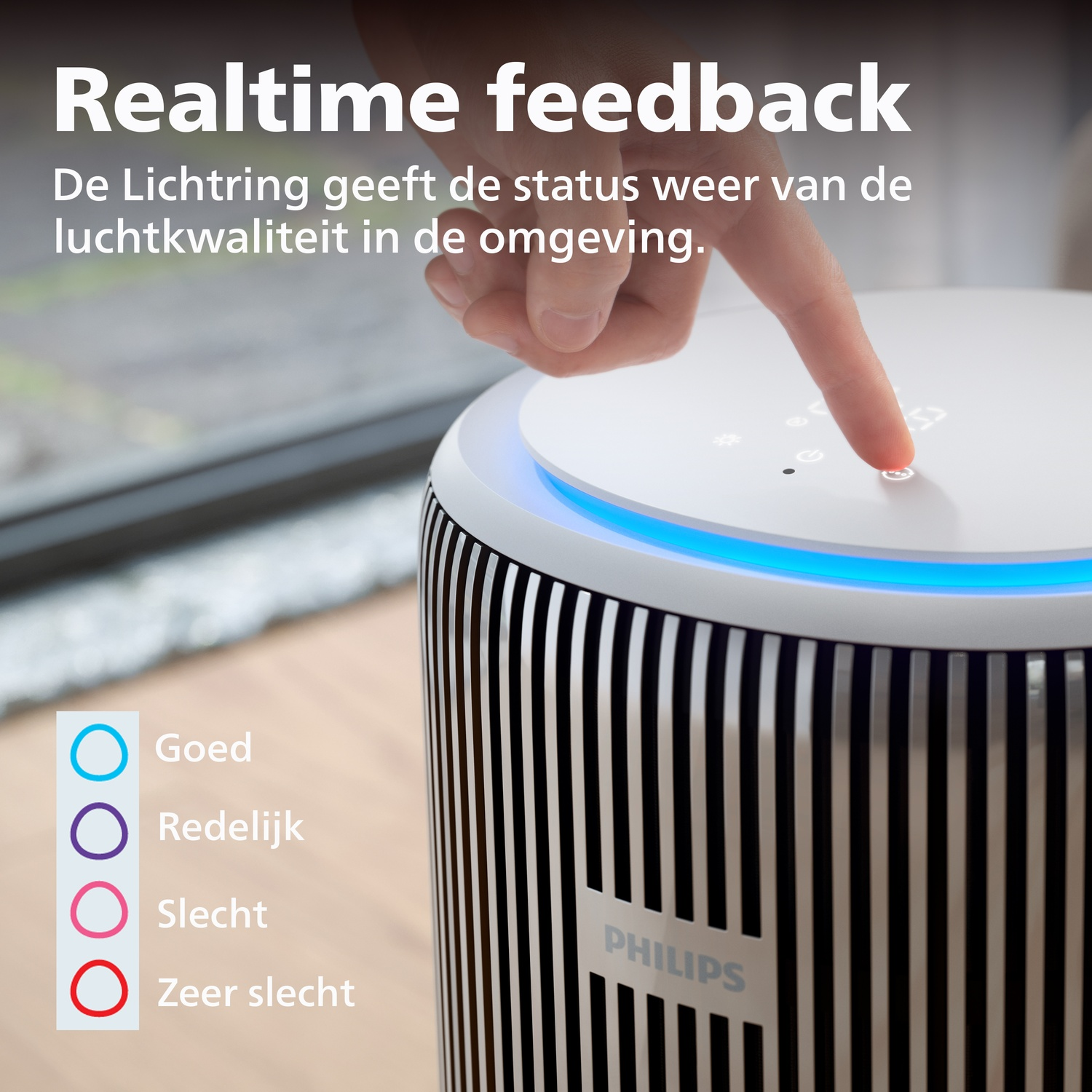 A Philips air purifier with a light ring indicating air quality.