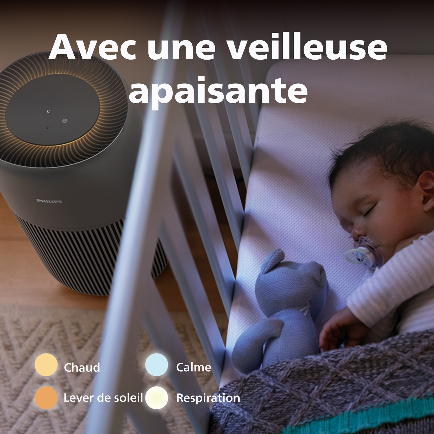 A baby sleeps in a crib next to an air purifier and a teddy bear.