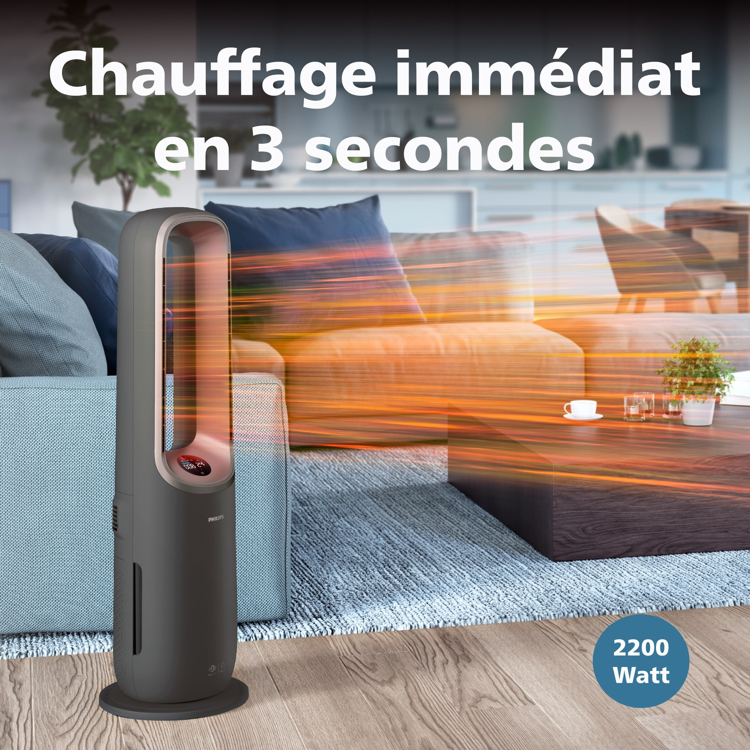 Un radiateur Philips sombre sur sol bois près d'un canapé. 2200 Watts.
