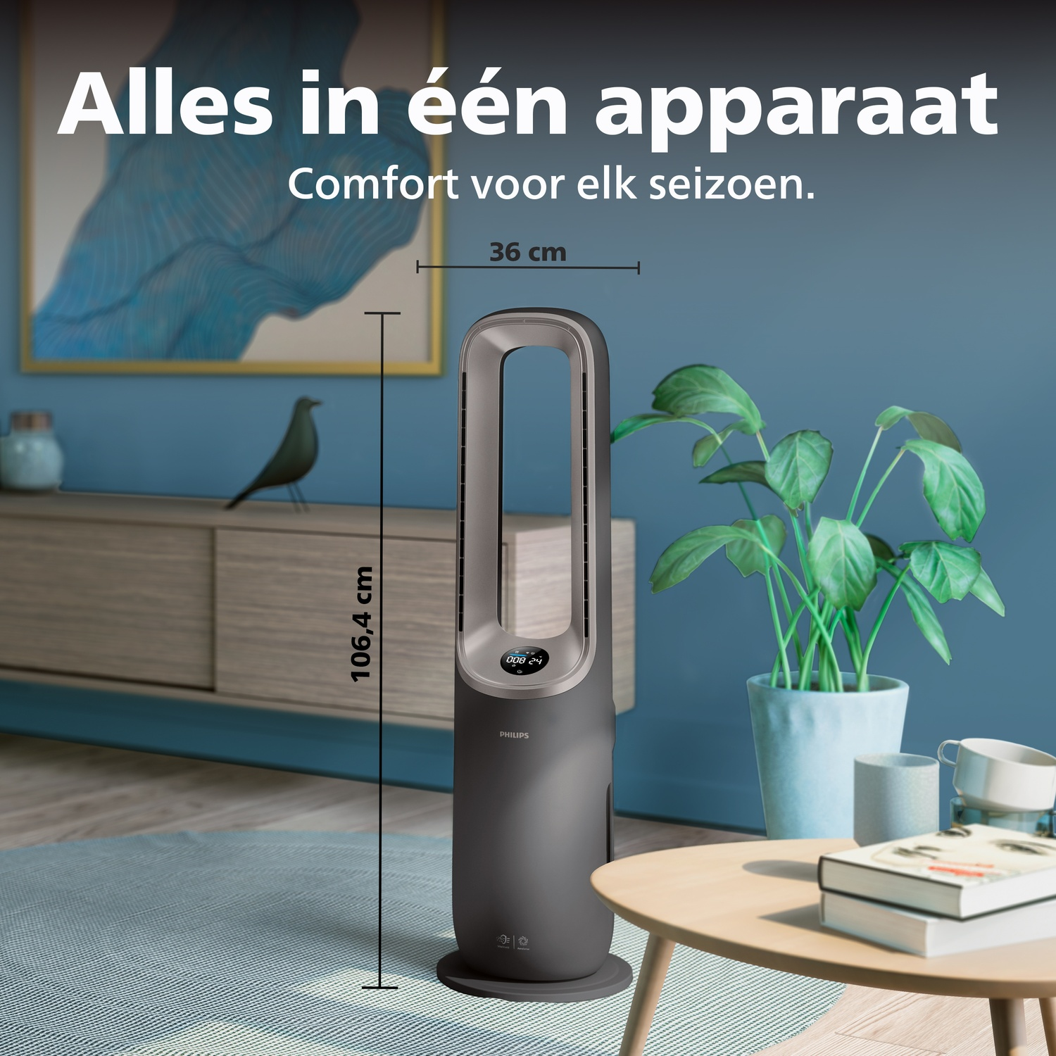Een donkere Philips torenventilator staat op een kleed naast planten.