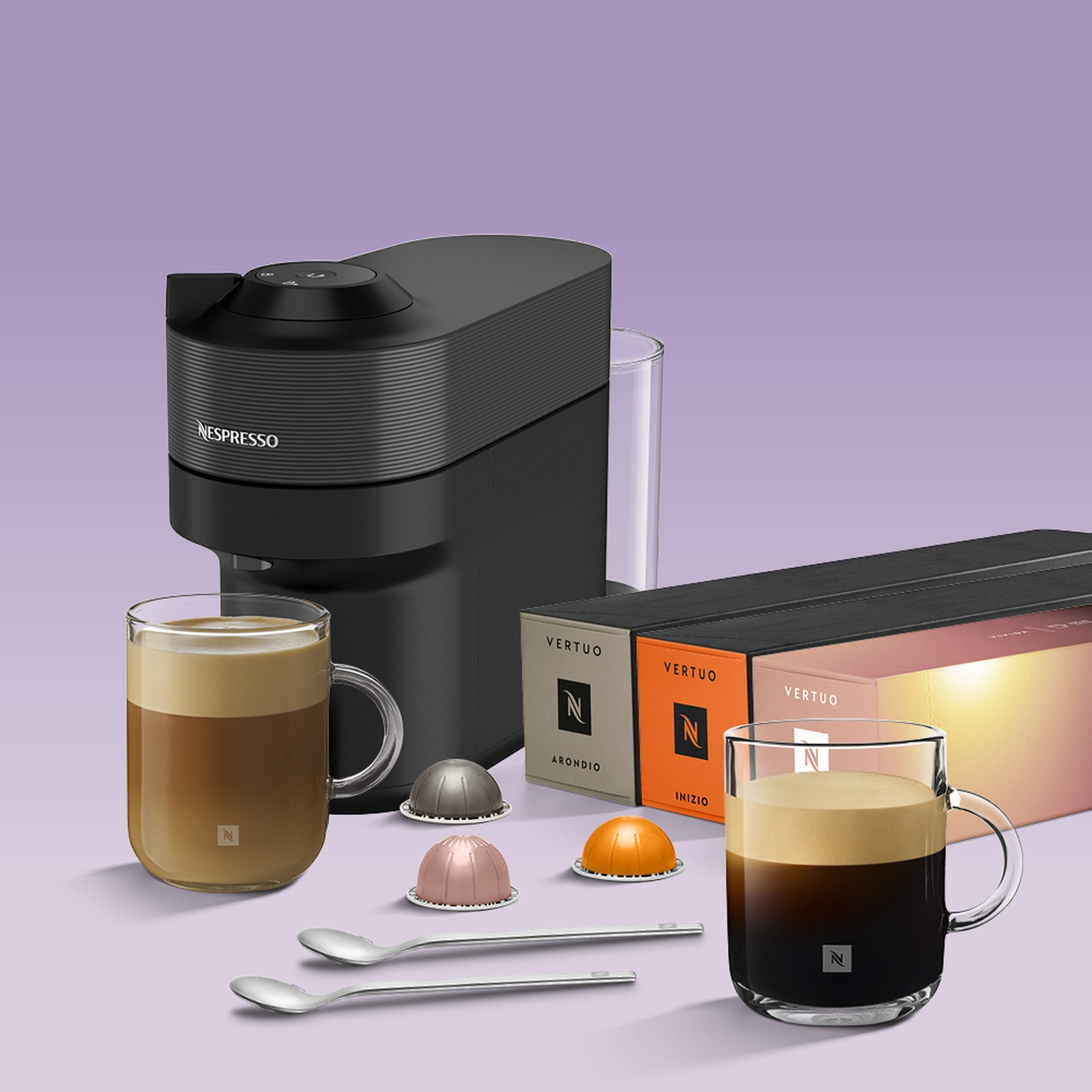 Nespresso machine with coffee, capsules, and cups on a purple background.
