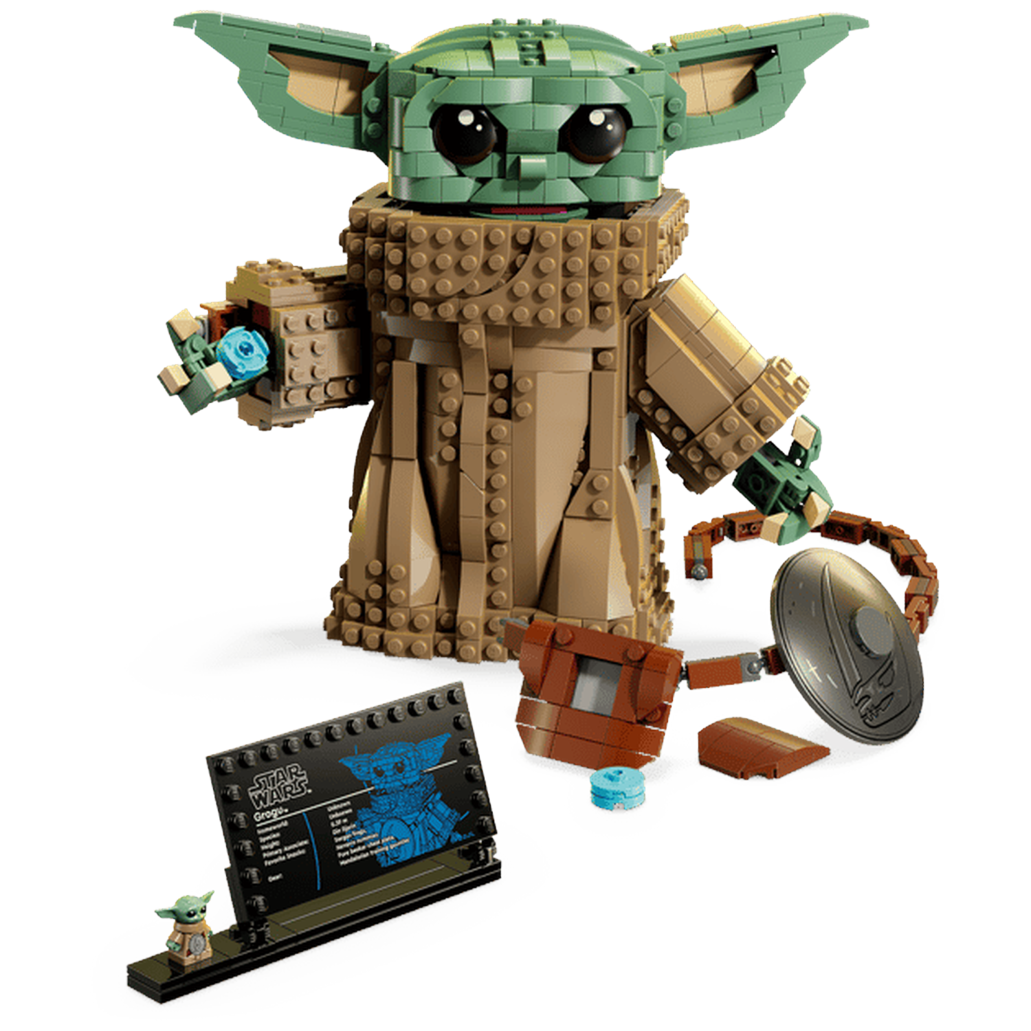 Een Lego-model van Grogu houdt een blauwe knop vast. Accessoires en een standaard zijn nabij.