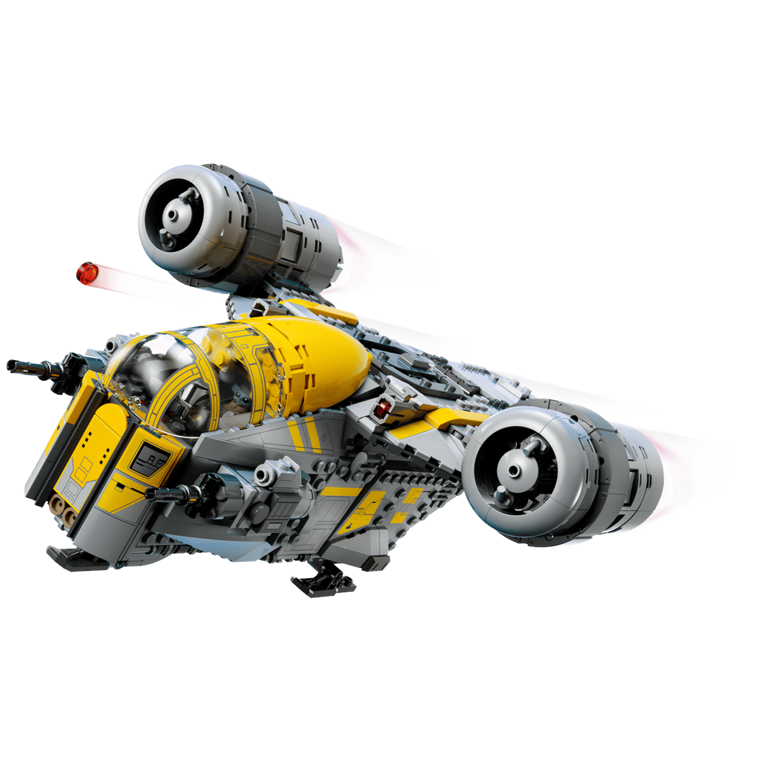 A yellow and gray spaceship flies against a black background, engines glowing.