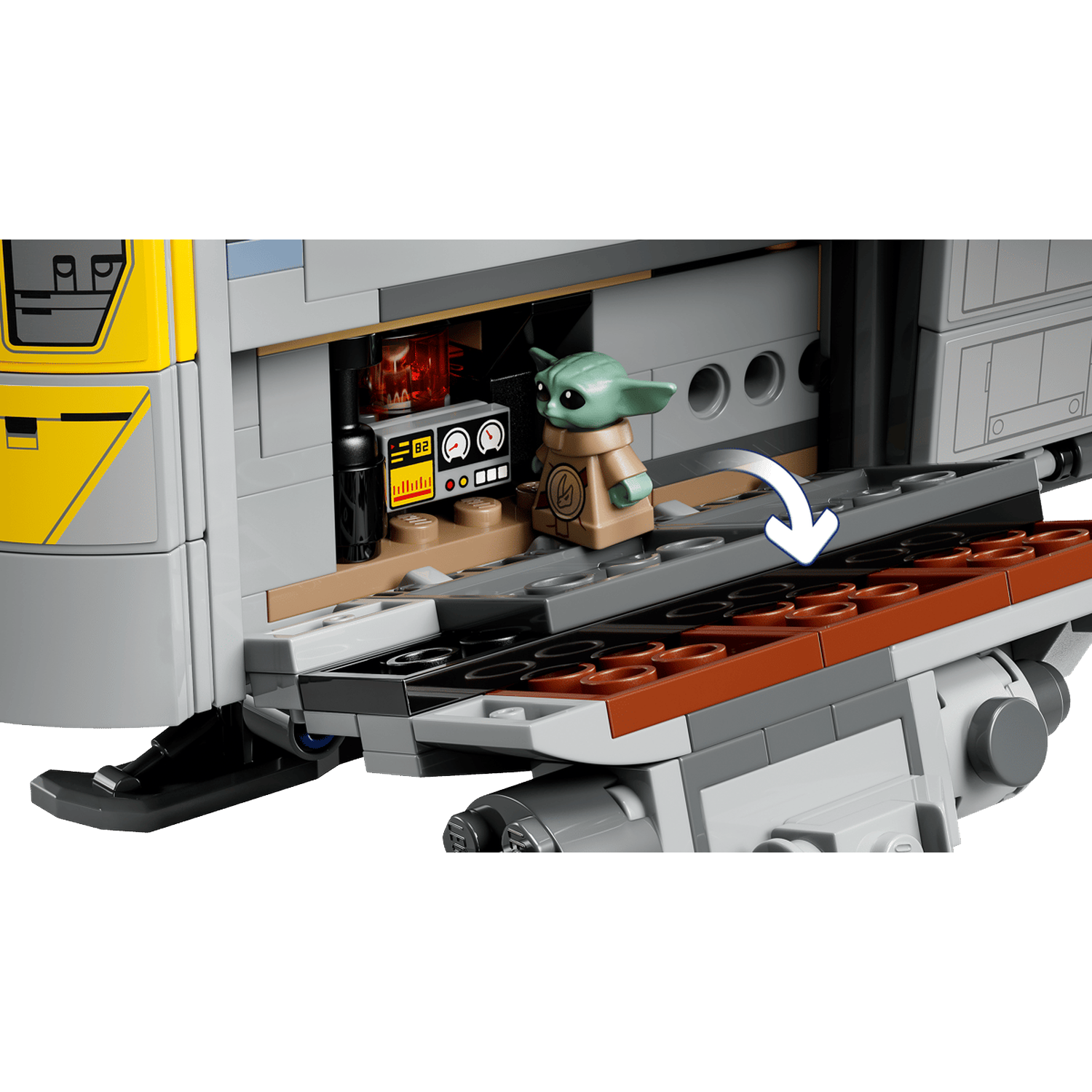 A small green creature stands near a console with gauges and buttons on a gray Lego structure.