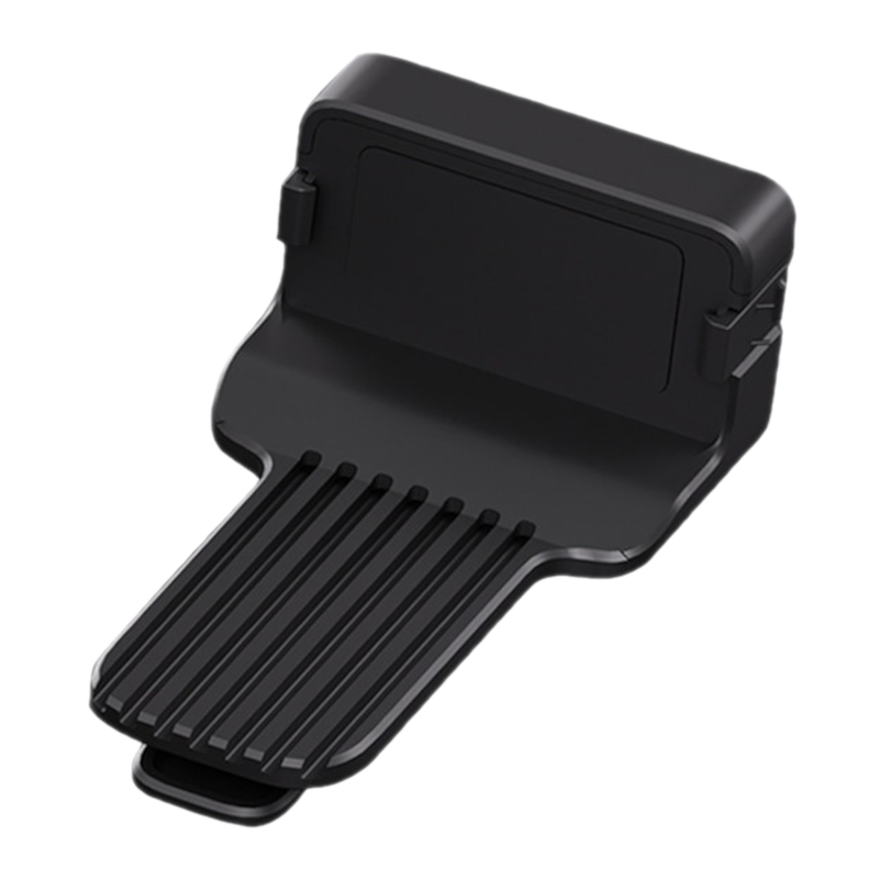 Un accessoire en plastique noir avec des rainures à l'avant et une surface supérieure plate.