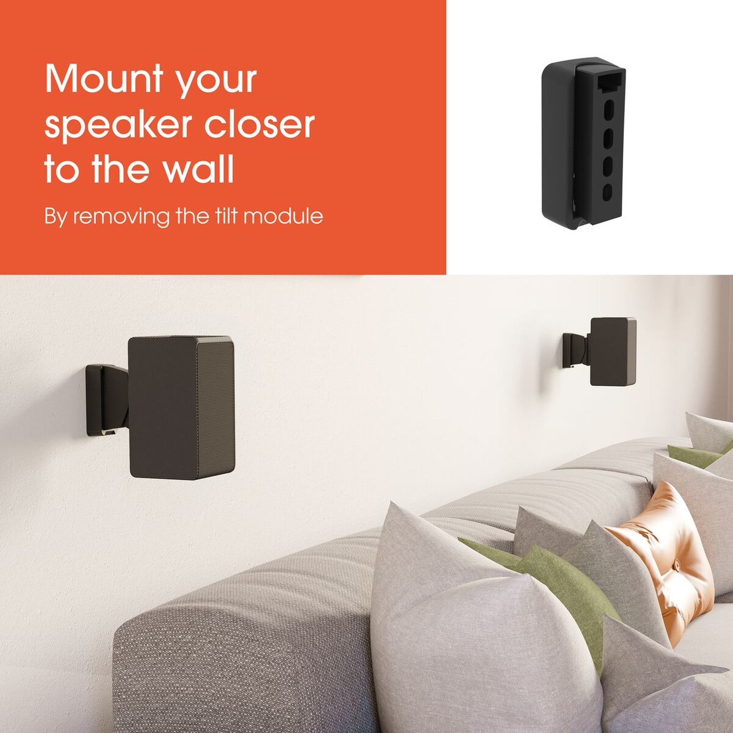 Support d'enceinte noir sur mur blanc au-dessus d'un canapé gris avec coussins.