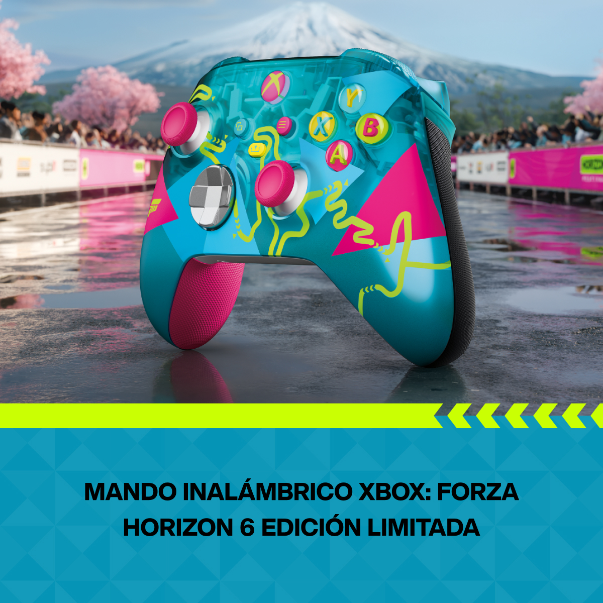 Un mando Xbox turquesa con acentos rosas sobre superficie mojada, montañas al fondo.