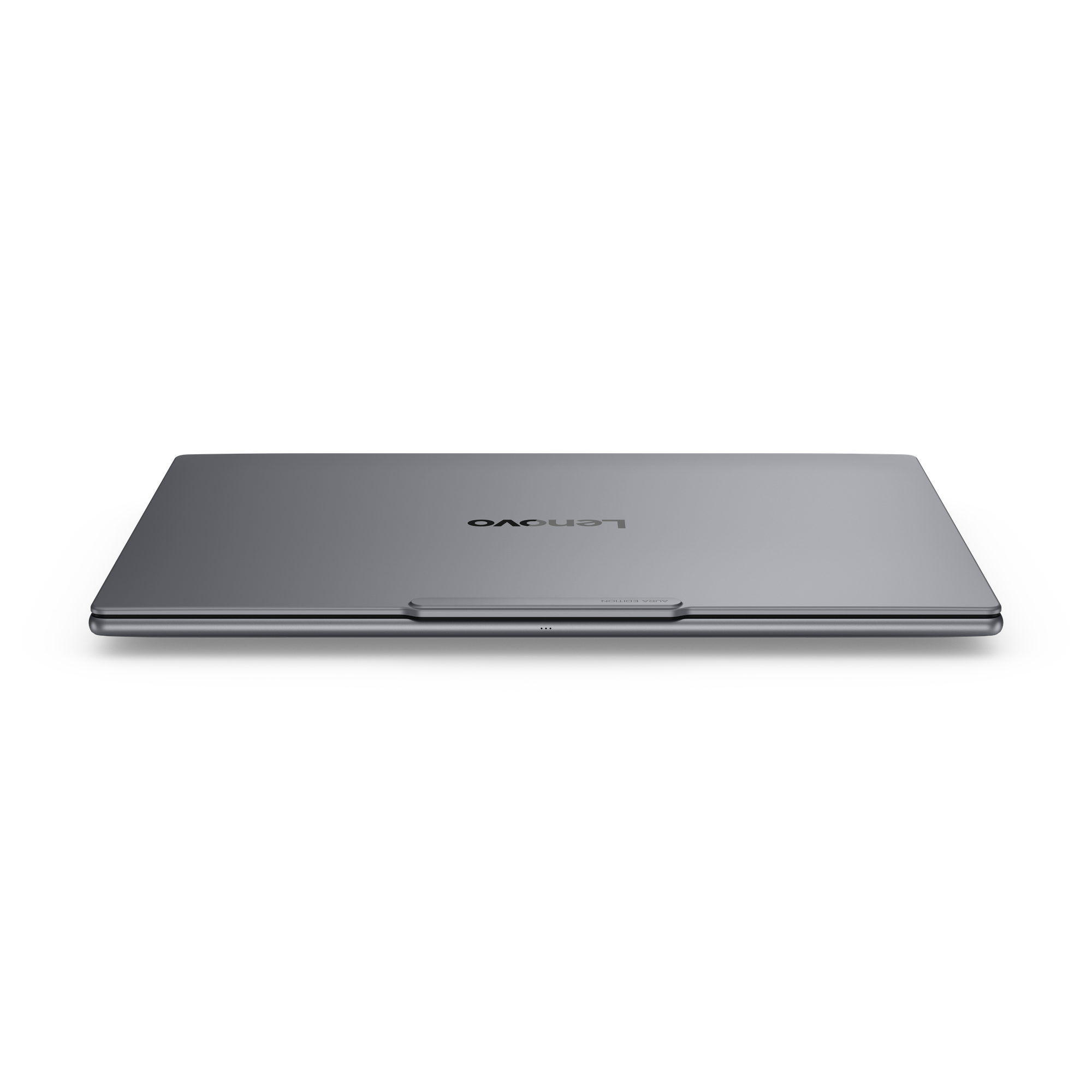 Geschlossenes silbernes Lenovo Laptop mit 'AURA EDITION'-Schriftzug auf schwarzem Hintergrund.