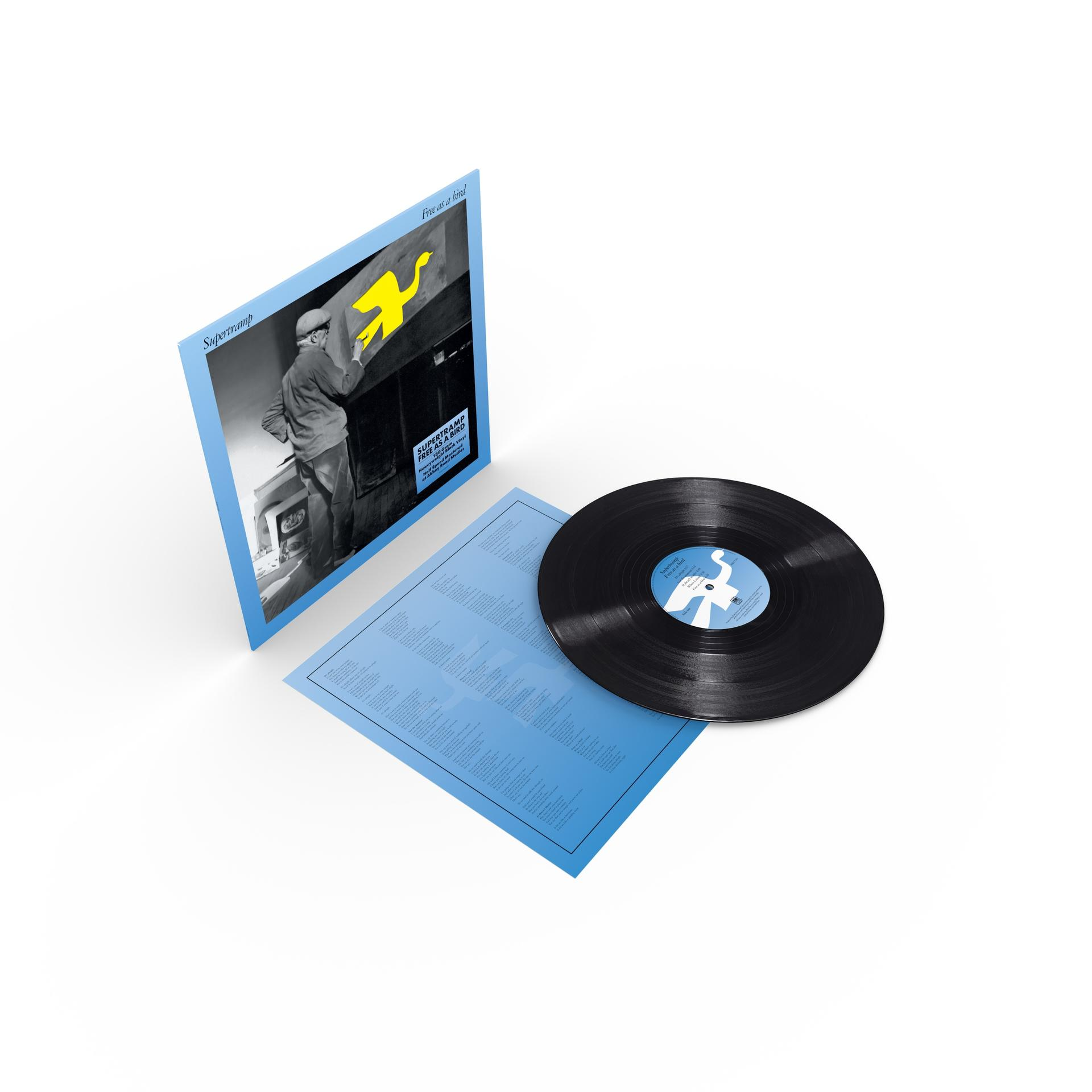 Eine Schallplatte und das Albumcover von Supertramp liegen auf blauem Papier.