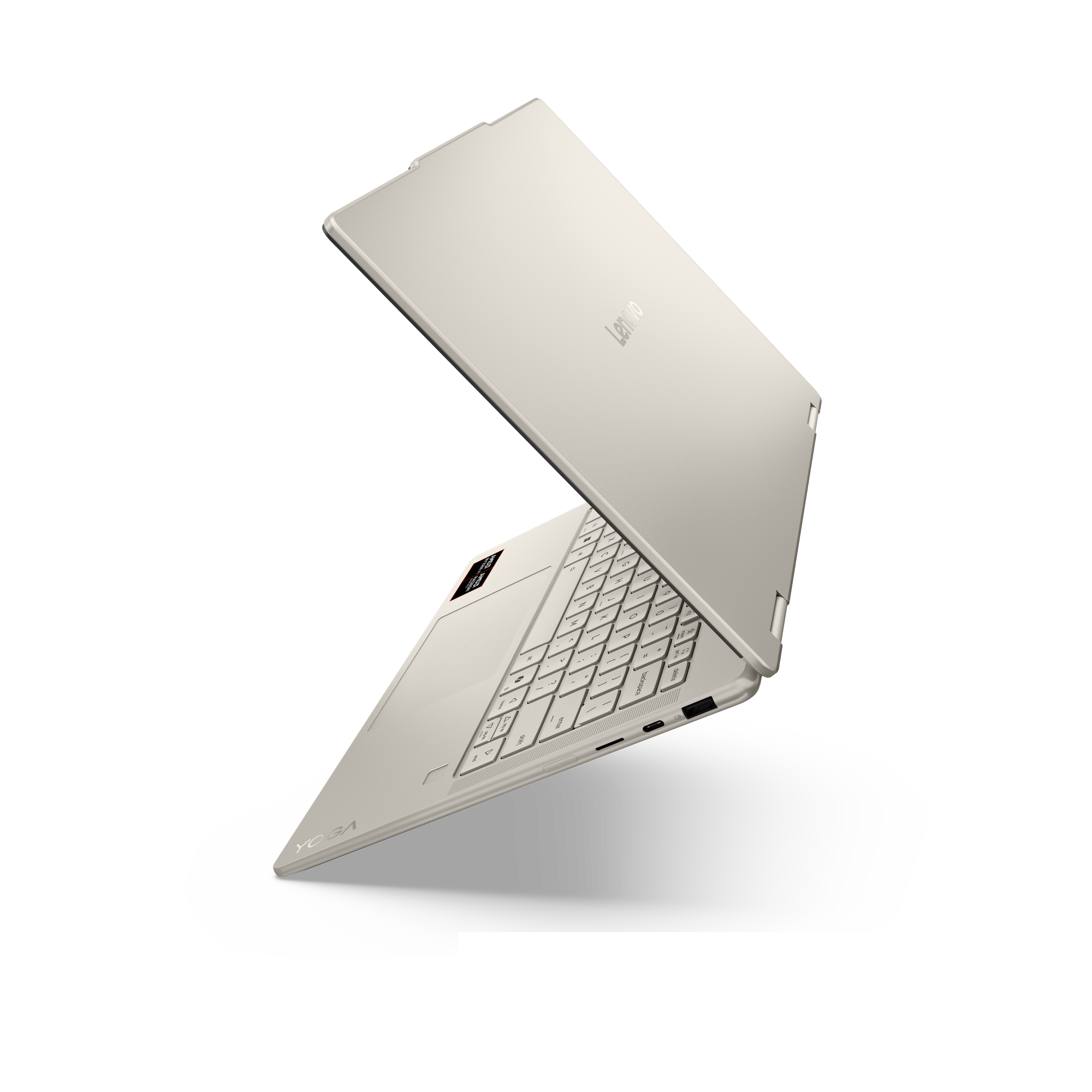 Ein hellgraues Lenovo Yoga-Laptop, geöffnet, mit Tastatur und Touchpad auf schwarzem Hintergrund.
