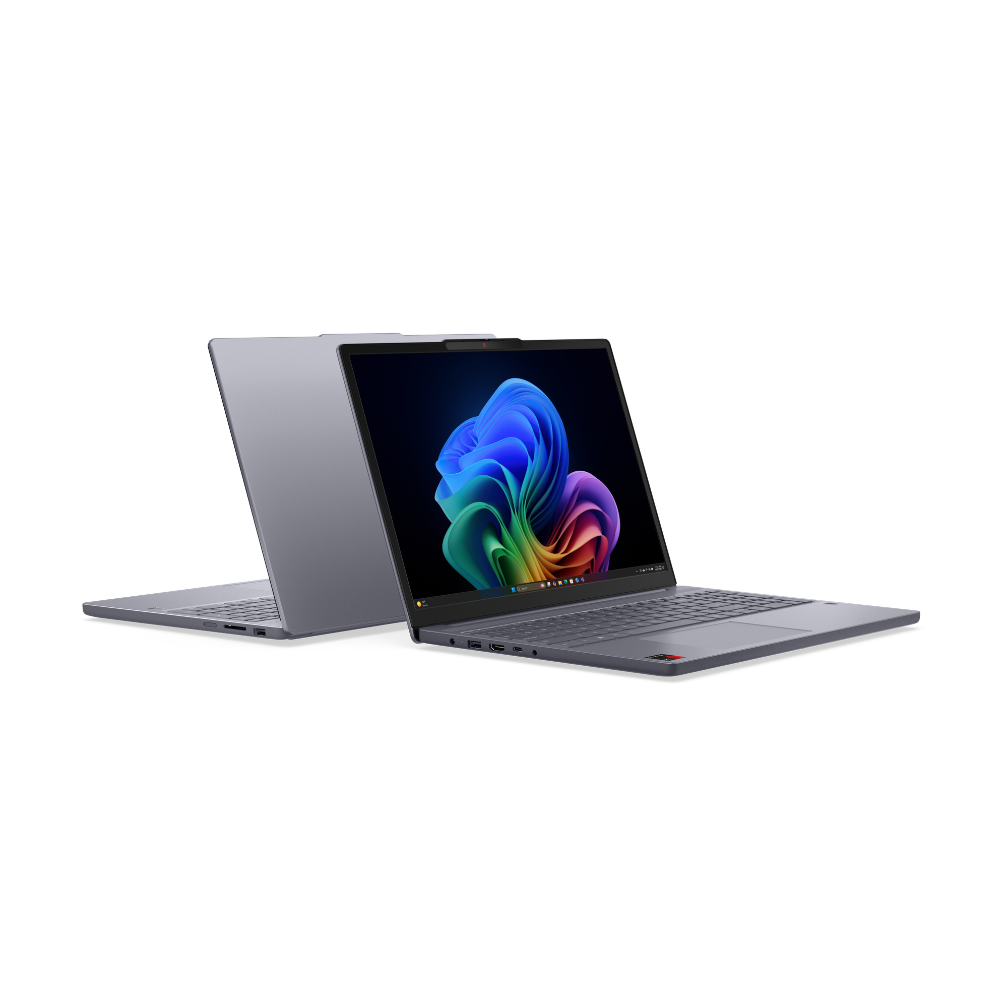 Zwei graue Laptops, einer geöffnet mit bunter Anzeige. Schwarz.