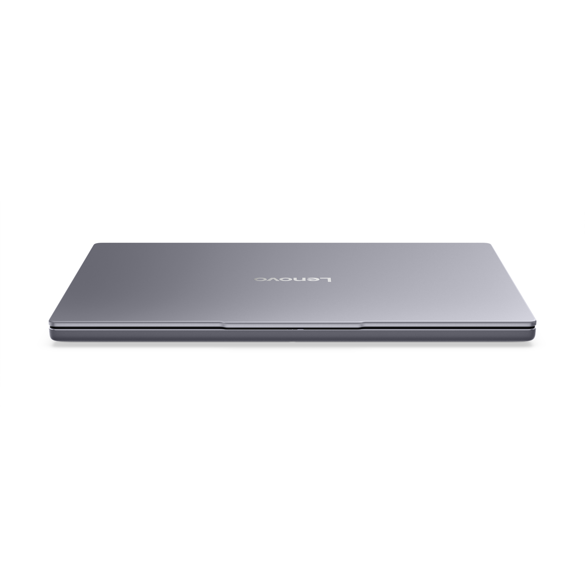 Geschlossener, grauer Lenovo Laptop auf schwarzem Hintergrund.