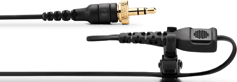 Un microphone noir avec prise jack 3,5 mm dorée et câble sur fond noir.