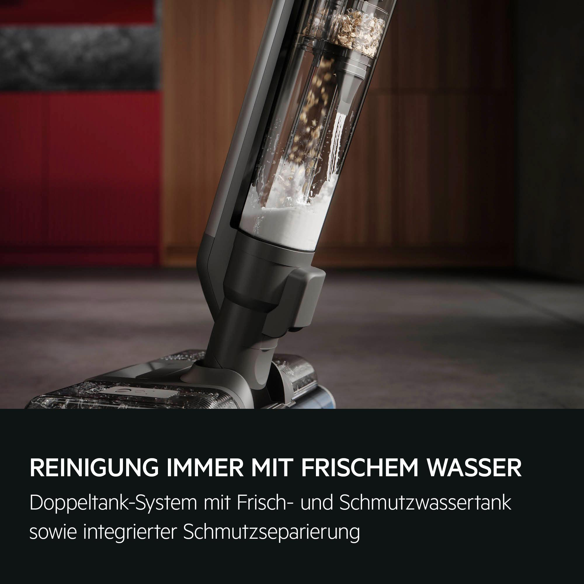 Ein Bodenreiniger mit transparentem Tank für Frischwasser und Schmutz.