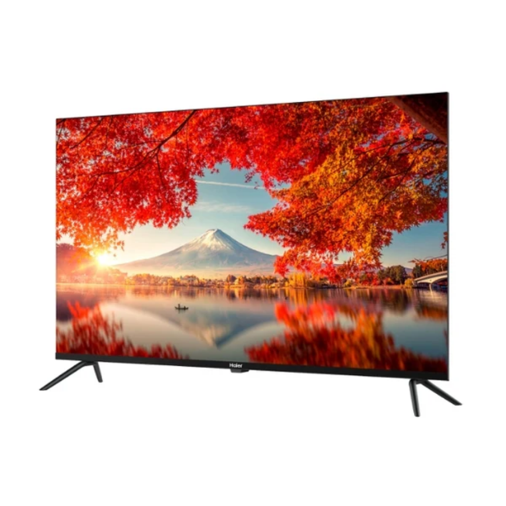 Un televisor muestra una imagen del Monte Fuji al atardecer con follaje otoñal.
