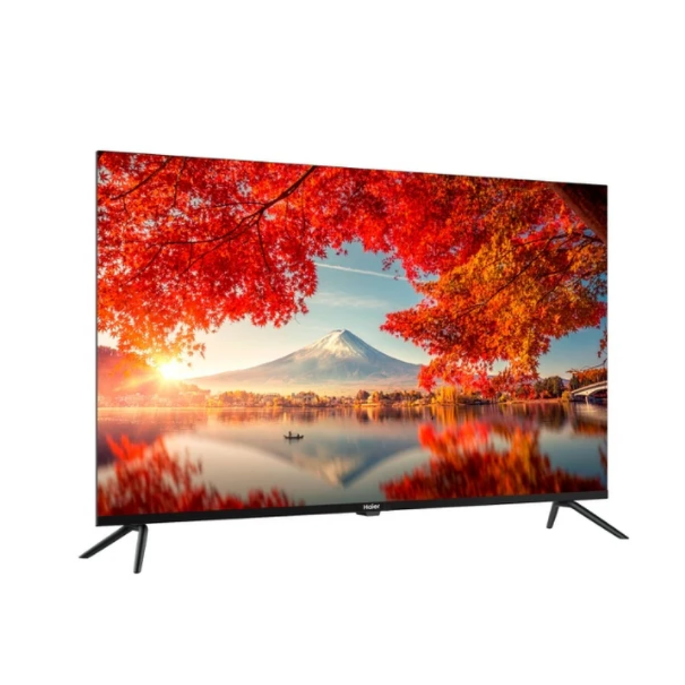 Un televisor muestra un paisaje con una montaña y árboles de otoño.